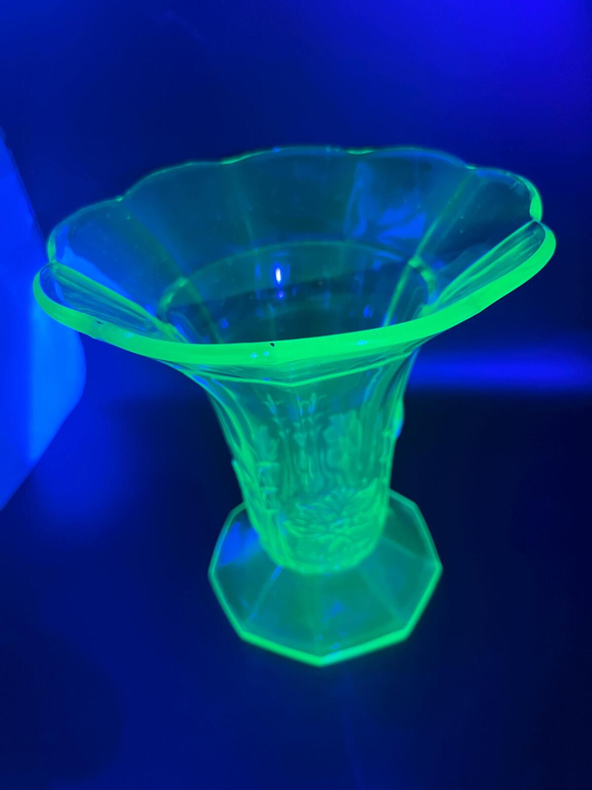Vintage antique uranium glass vase. Octagonal base with flared ruffle rim and floral imprint.