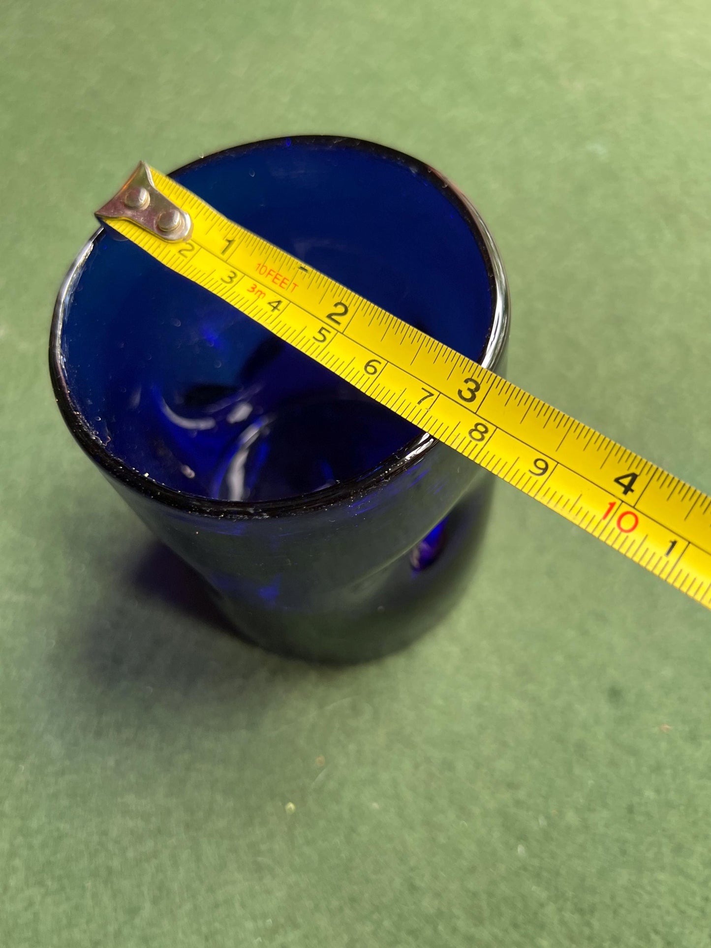Pinched hand blown glass cobalt blue drinking glass posy vase.