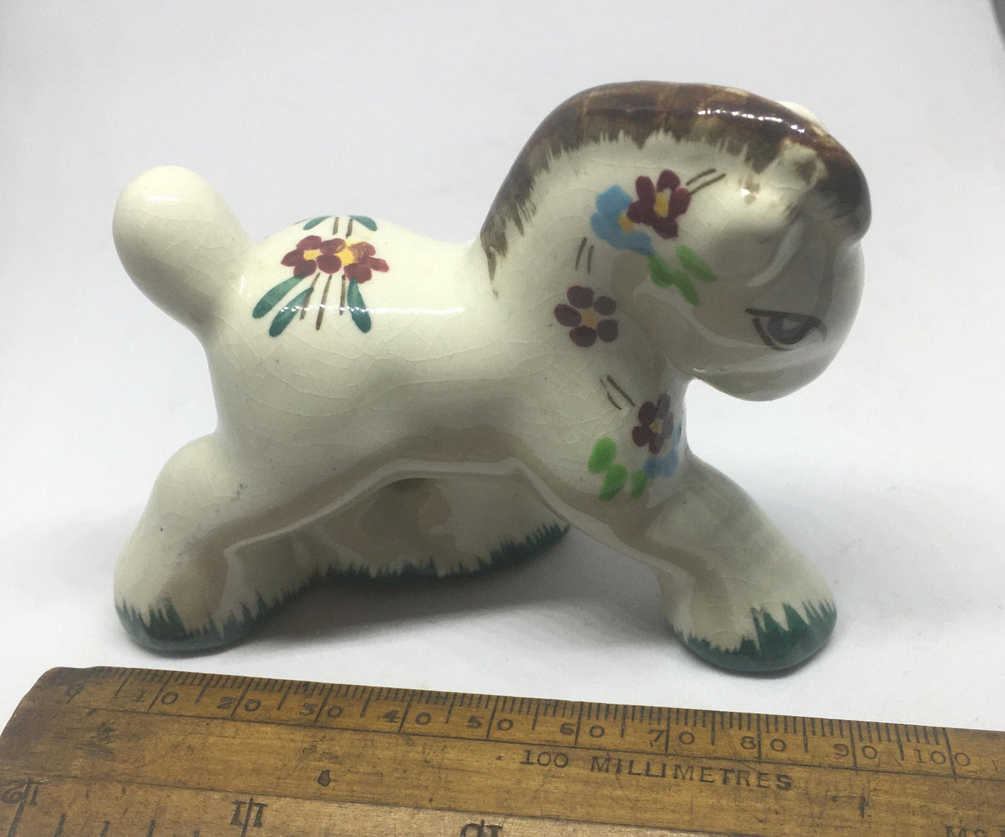 Folk art ceramic pony. Hand-painted prancing ceramic pony.
