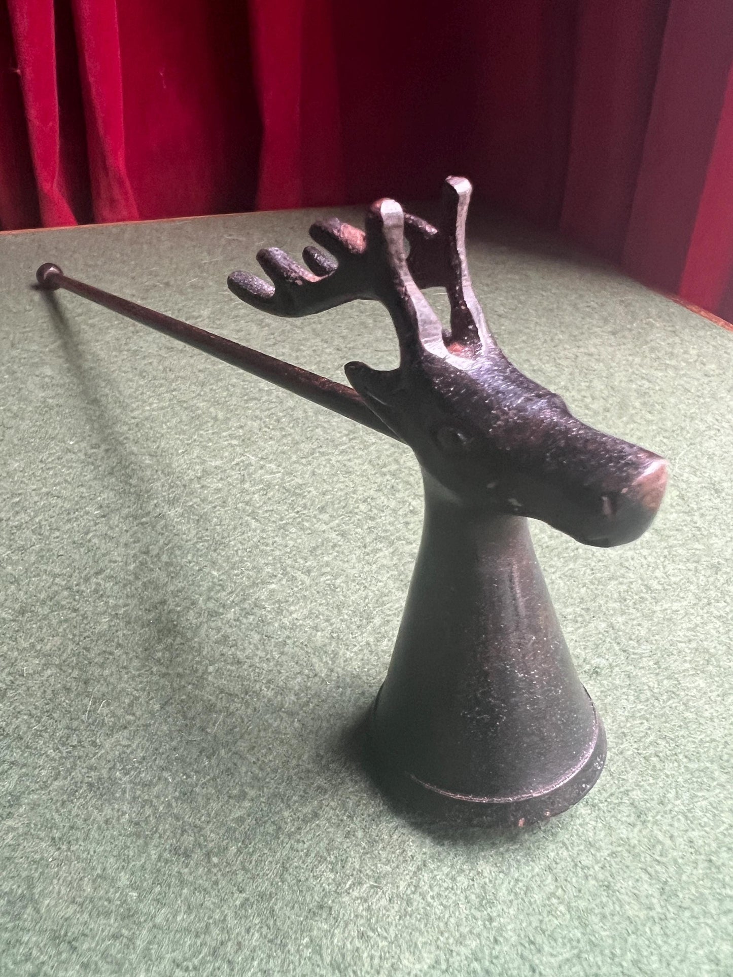 Vintage stag head candle snuffer. Black metal long handled candle extinguisher.