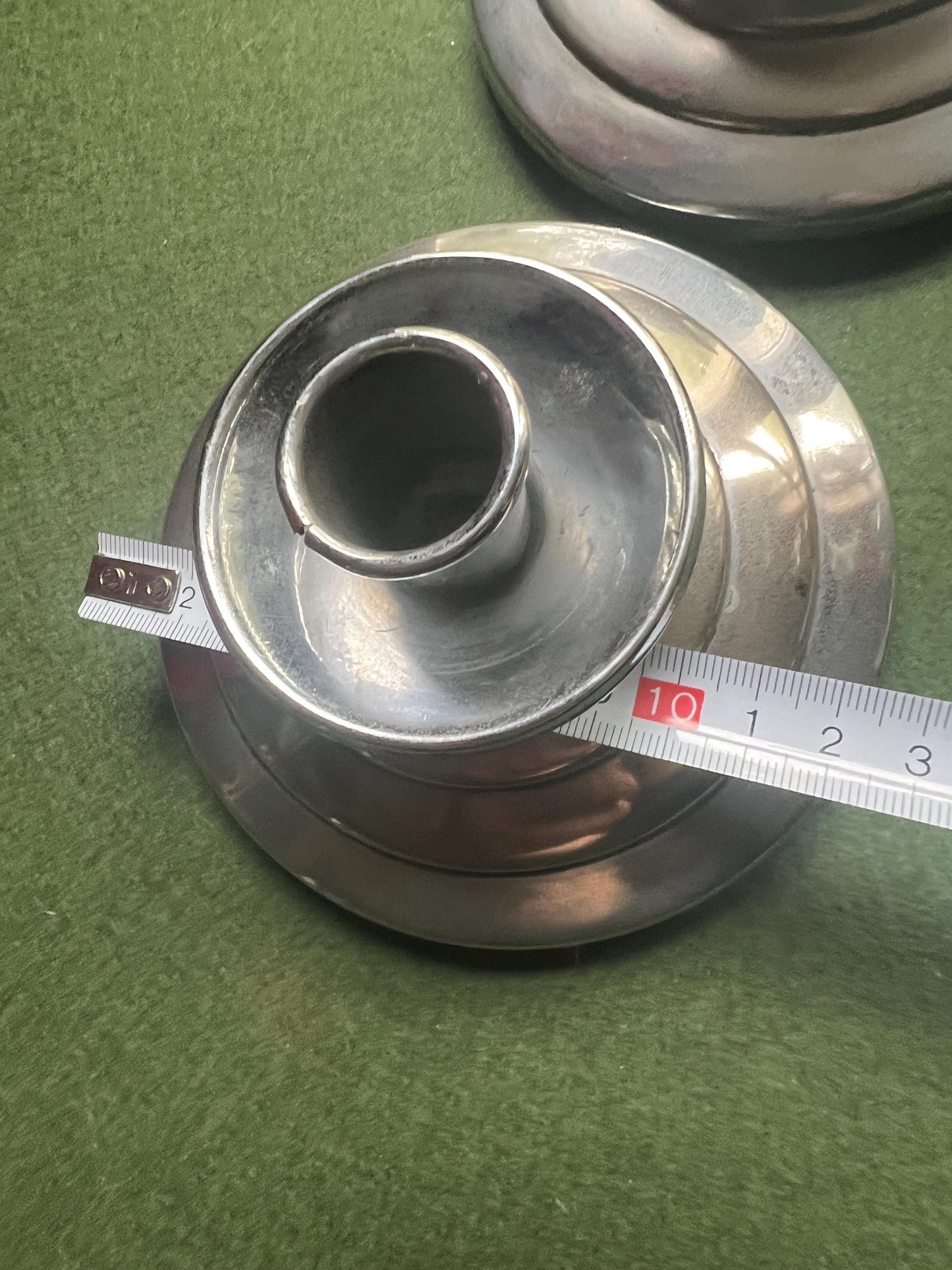 Pair of Art Deco style silver tone candlesticks. Stepped design metal candle holders.