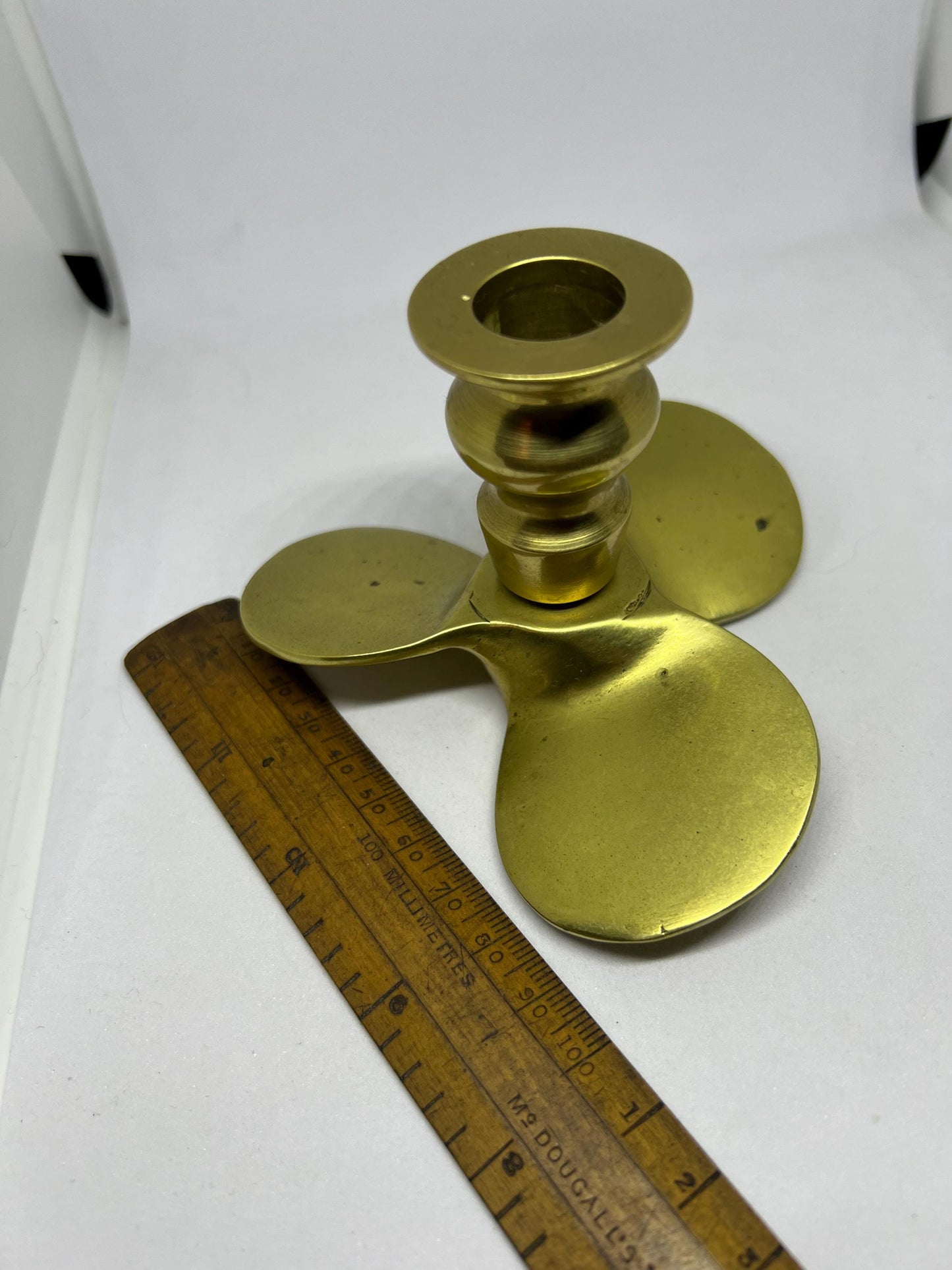 Brass candle stick Propellor shaped candle holder.