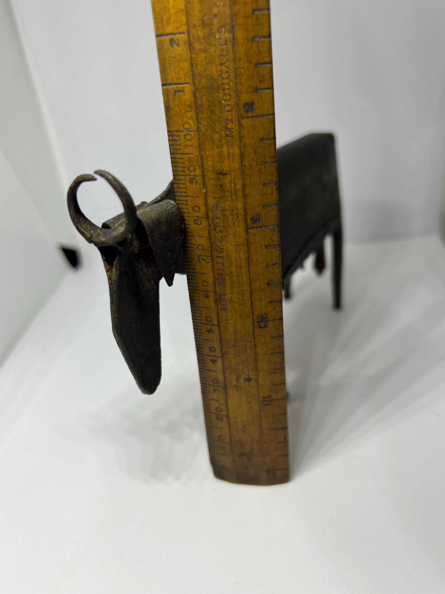 Brutalist metal cow sculpture. Iron abstract folk art figurine.