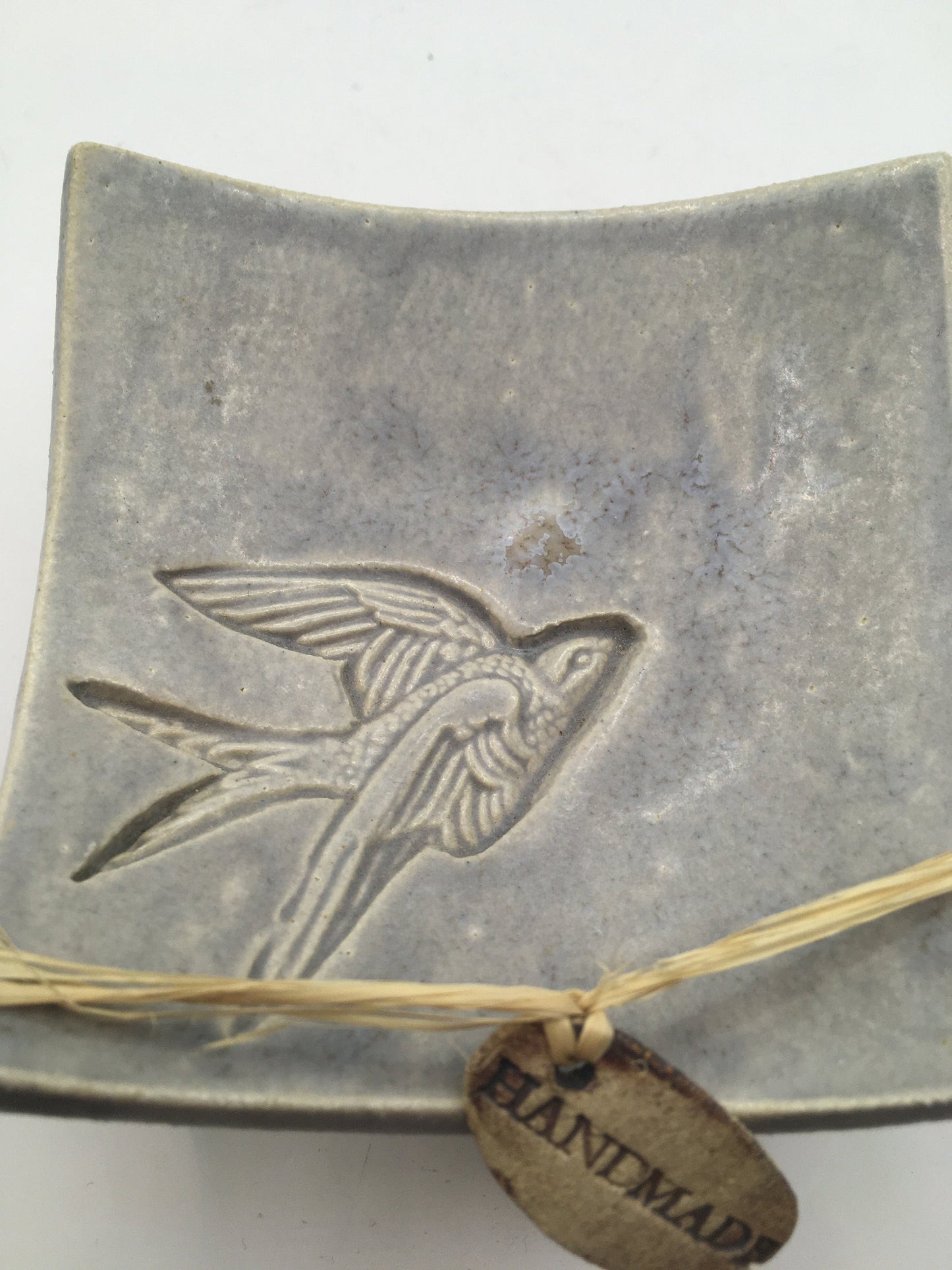 Handmade pedestal square trinket dish. Sgraffito flying bird design.