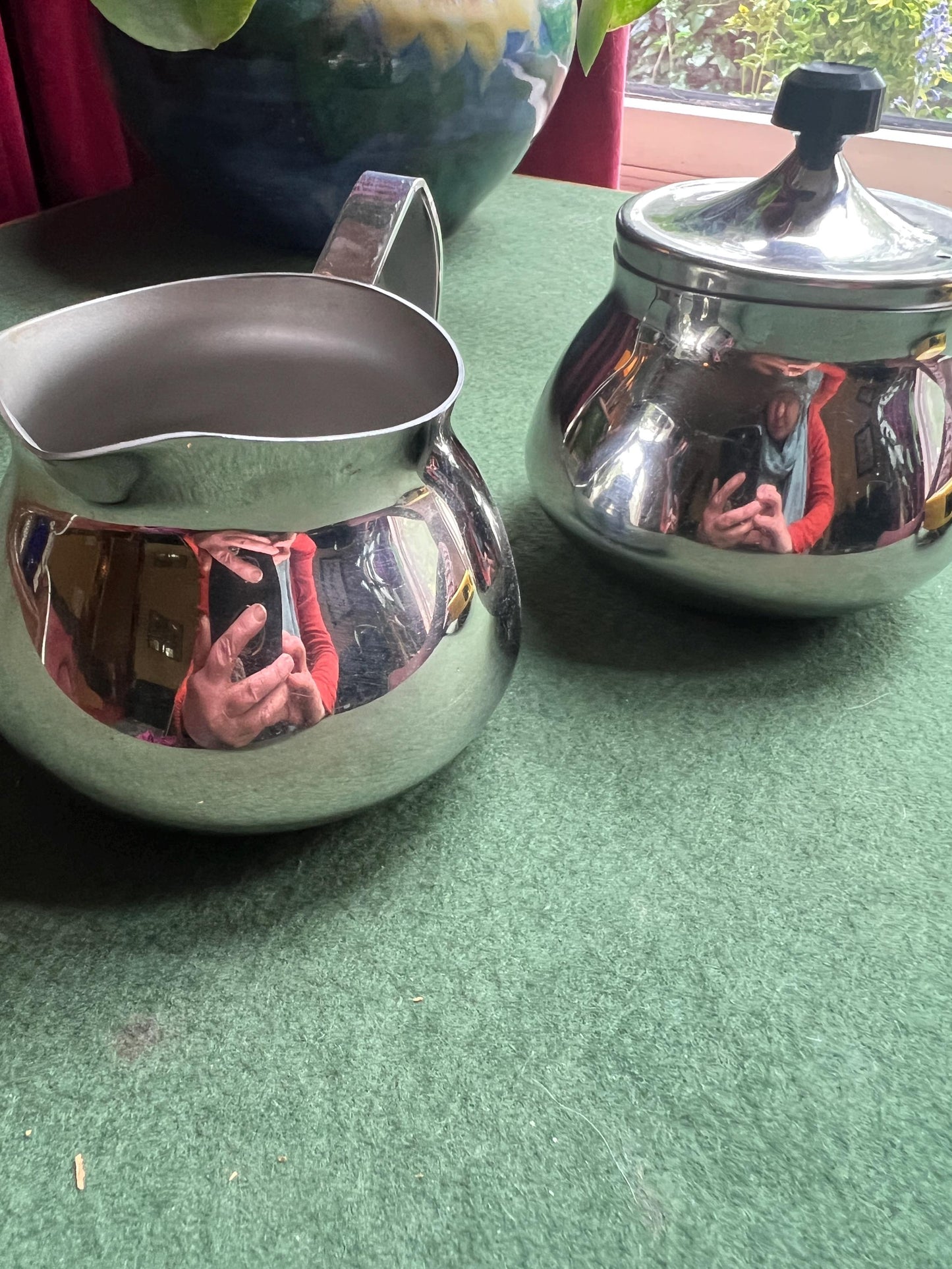 Stainless Steele lidded sugar bowl and creamer. Stamped Bramah of Sheffield Made in England.