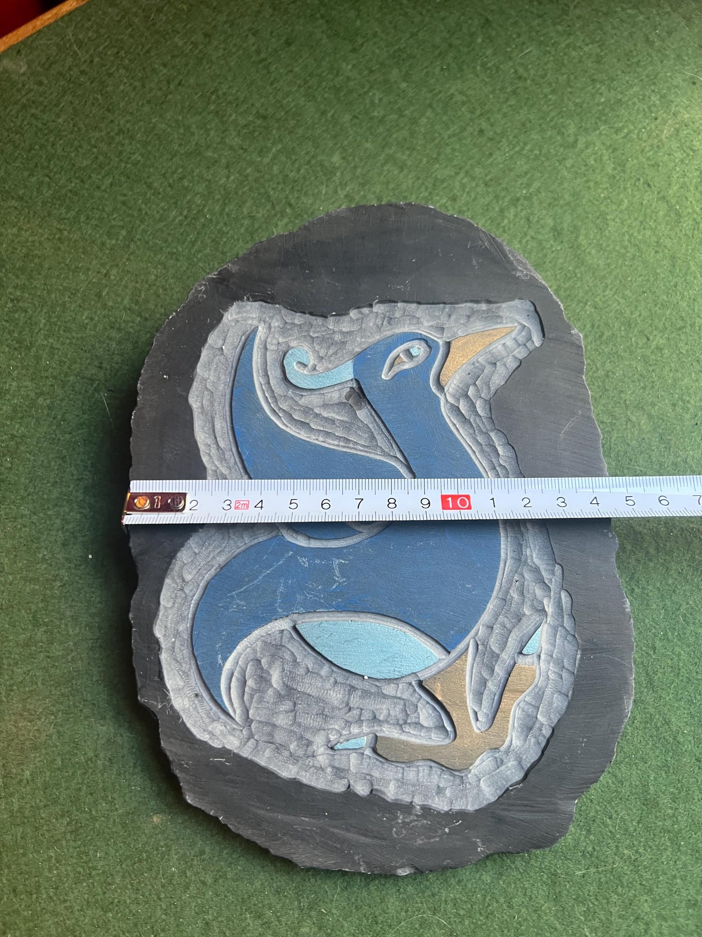Stylised bird slate carving wall decor.