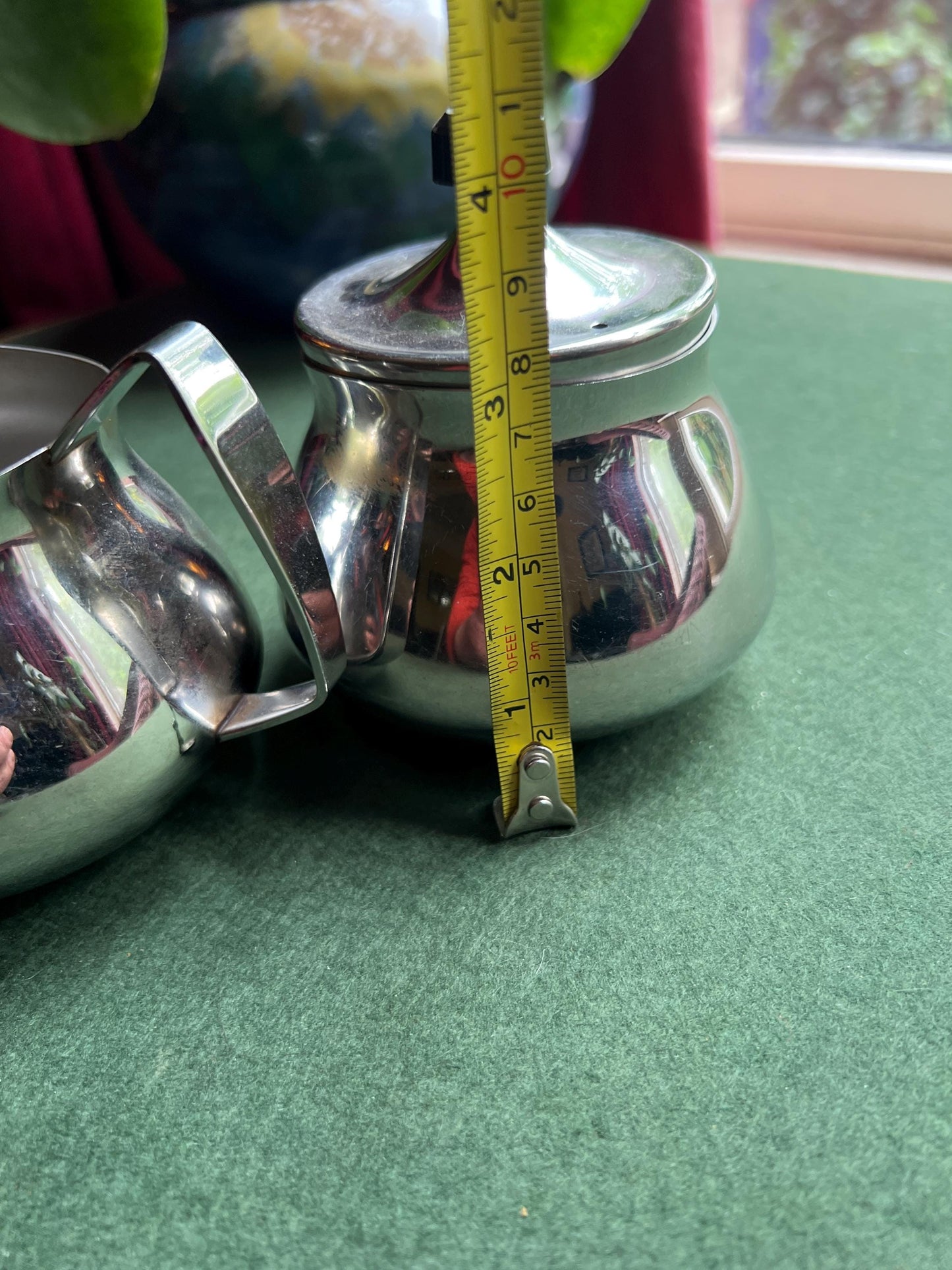 Stainless Steele lidded sugar bowl and creamer. Stamped Bramah of Sheffield Made in England.