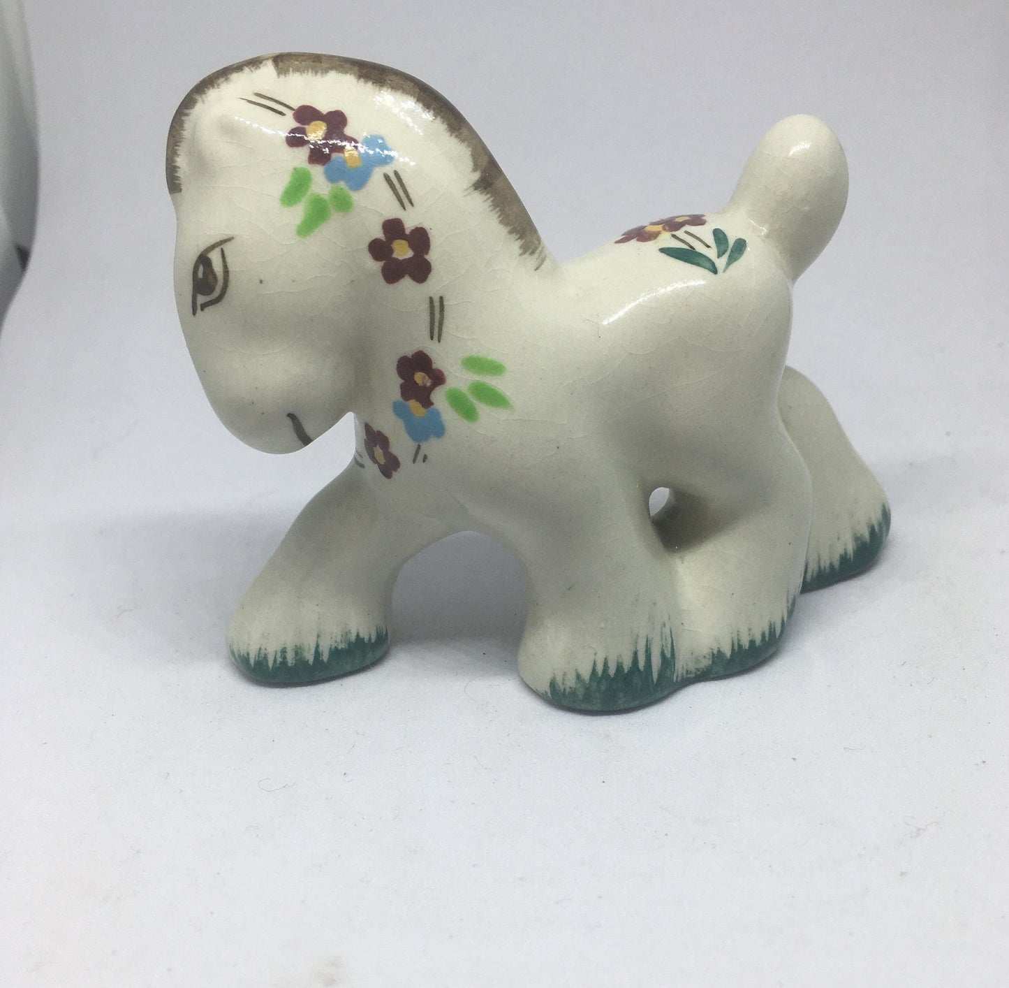 Folk art ceramic pony. Hand-painted prancing ceramic pony.