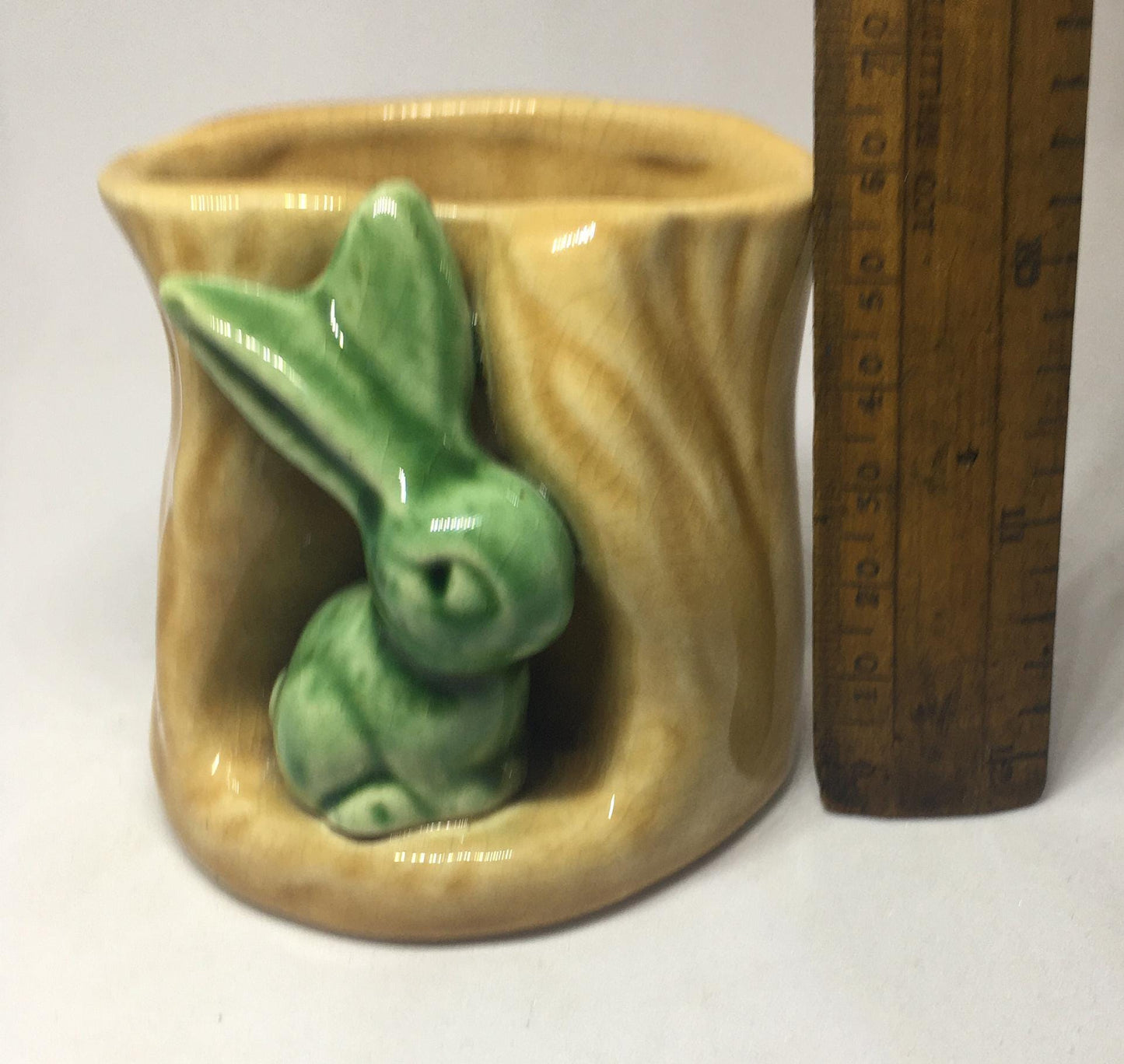 Campsie Ware green bunny by a tree stump planter vase.