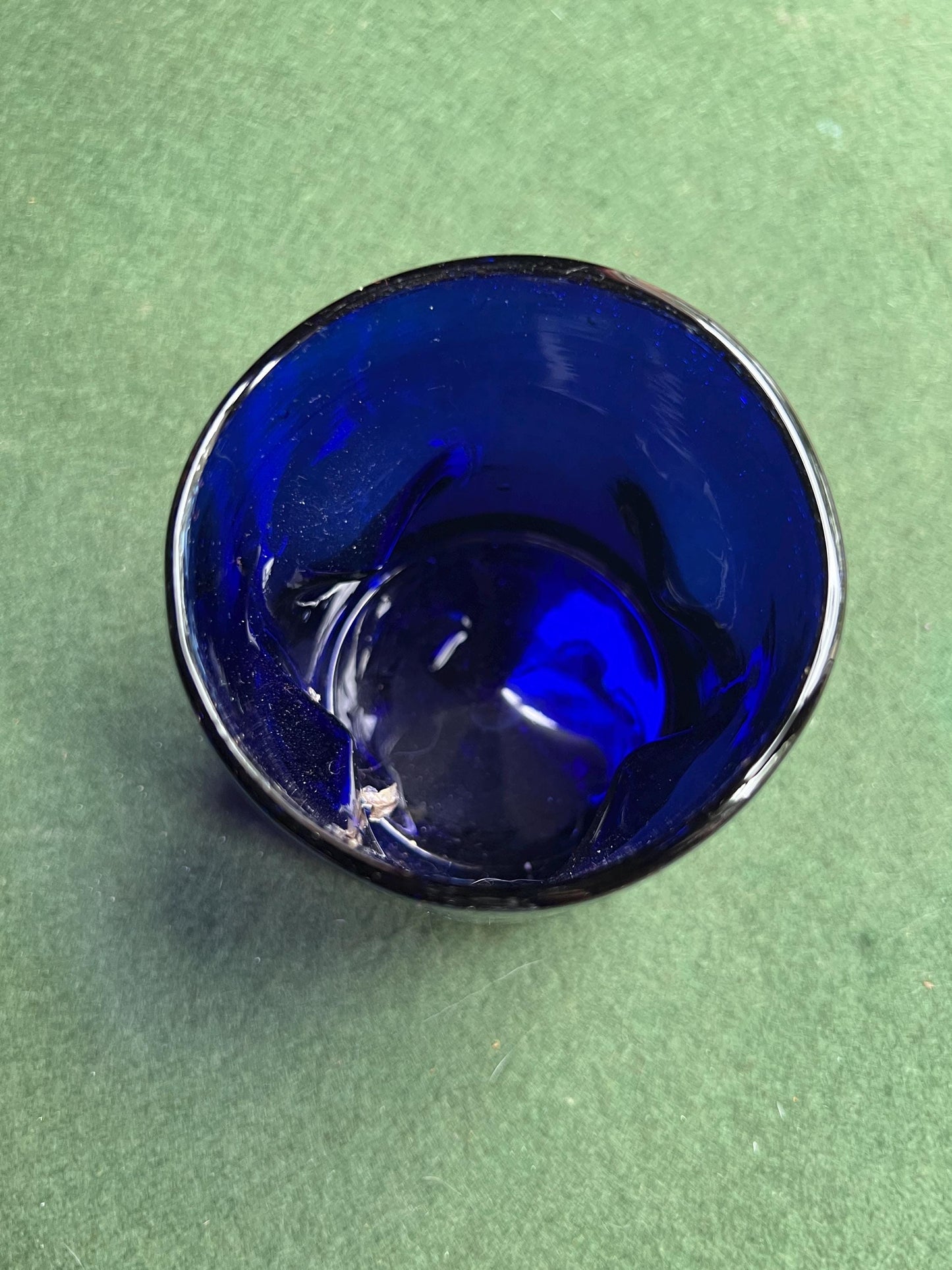 Pinched hand blown glass cobalt blue drinking glass posy vase.