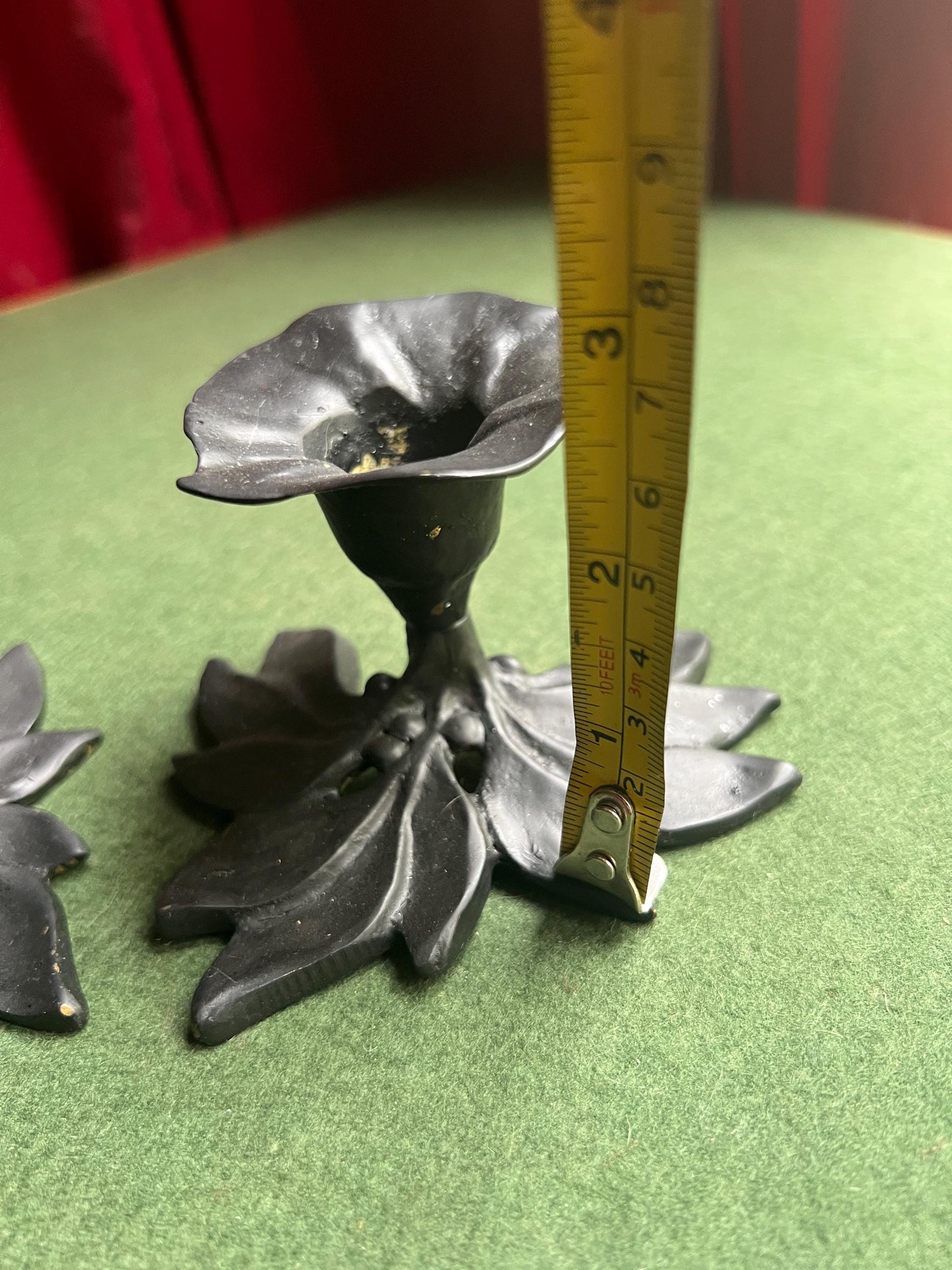 Pair of metal flower shaped candle holders Black metal trumpet flower with leaves