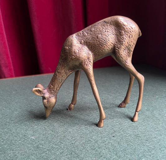 Vintage brass grazing deer figurine.