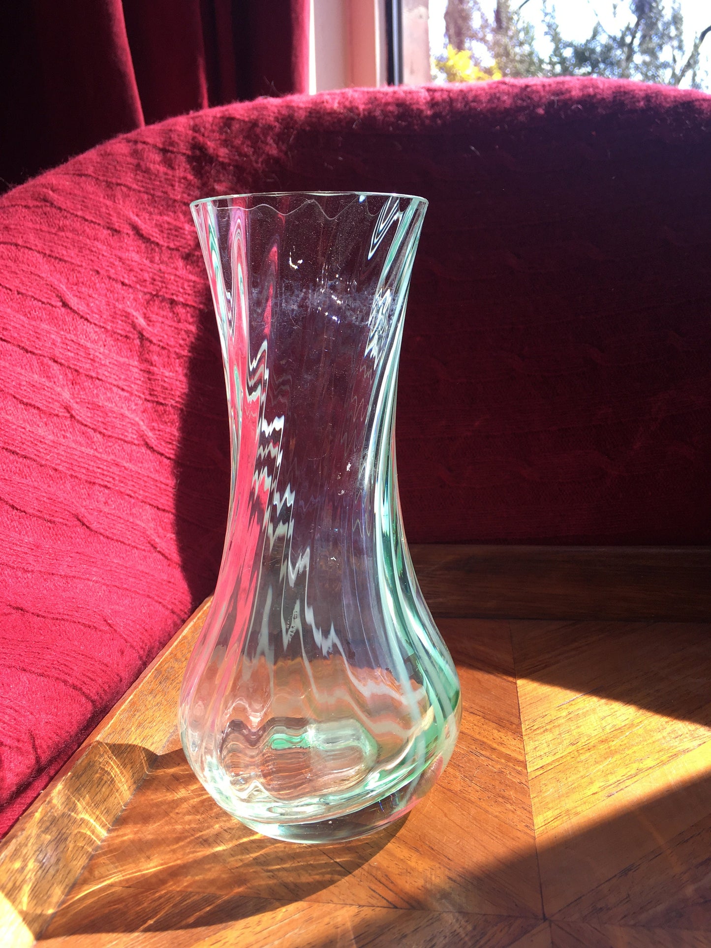 Beautiful vintage clear glass flower vase with green swirl detail. Heavy based.