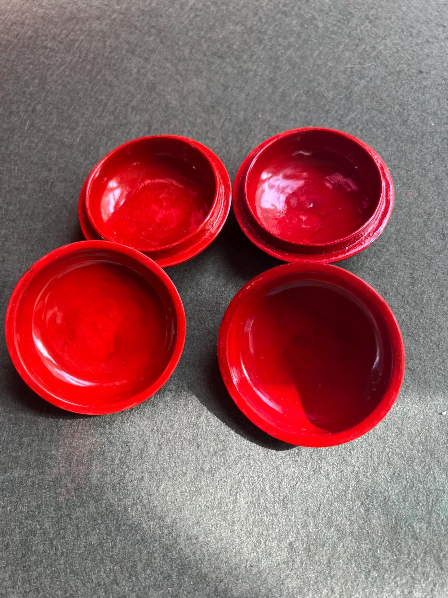 Pair of red and black lacquered lidded boxes. Tiny trinket ring boxes. Sold as a pair.