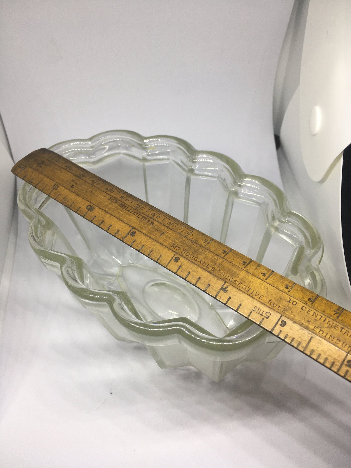 Vintage glass jelly mould. Clear pressed glass with scalloped edge. 10cm deep 16cm long.