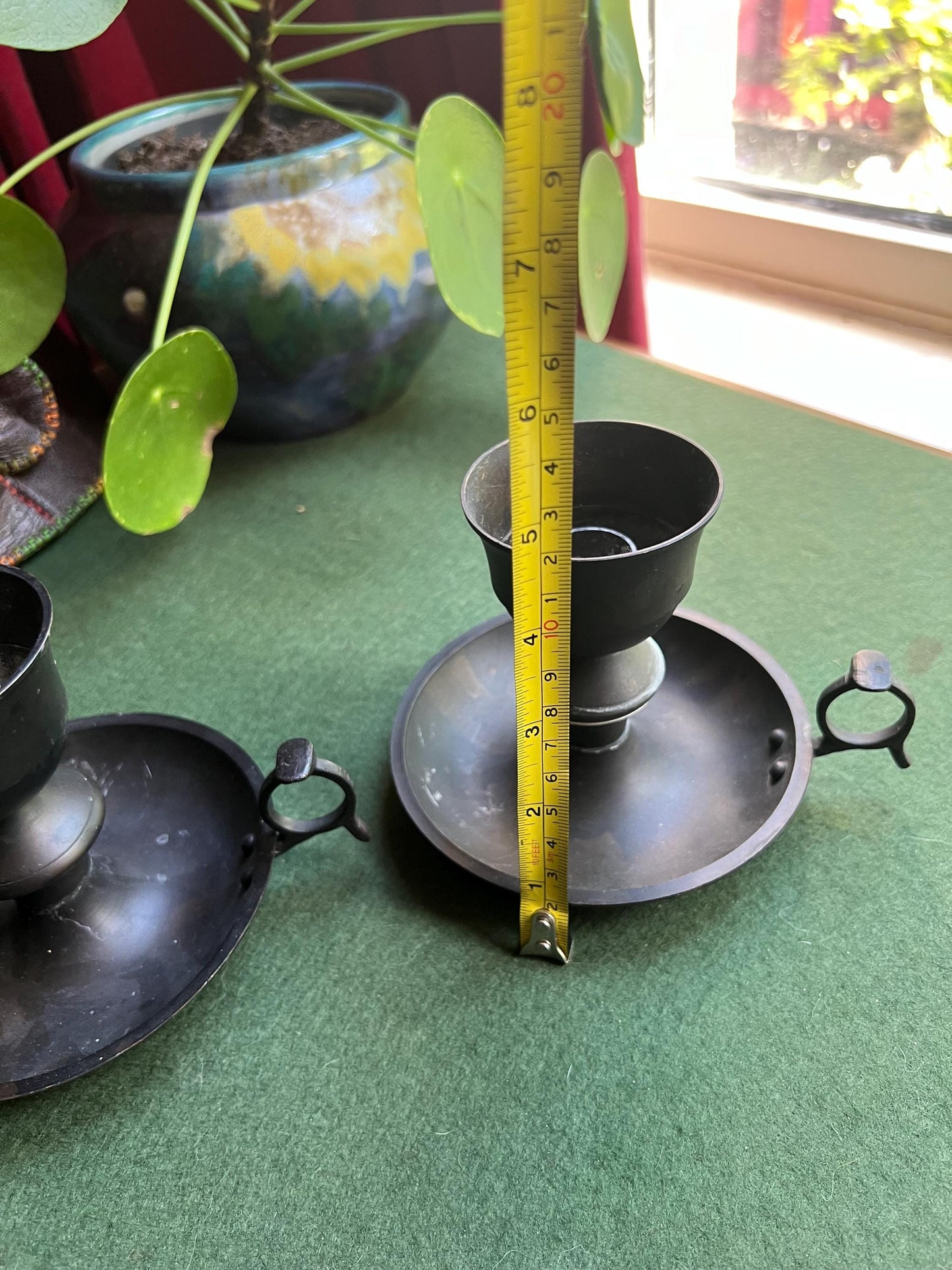 Vintage black metal thumb hold candle holder. Made in India stickers.