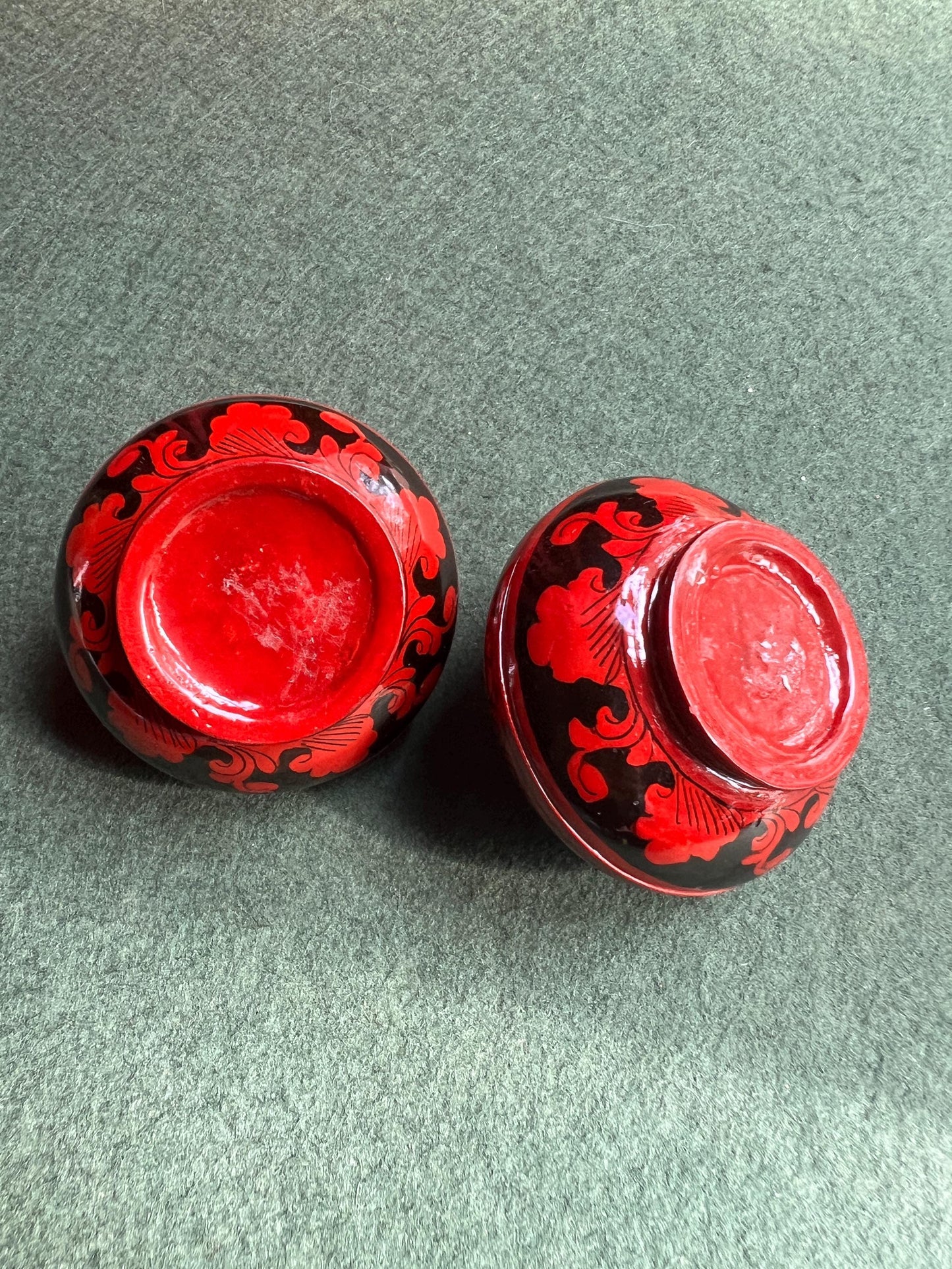 Pair of red and black lacquered lidded boxes. Tiny trinket ring boxes. Sold as a pair.