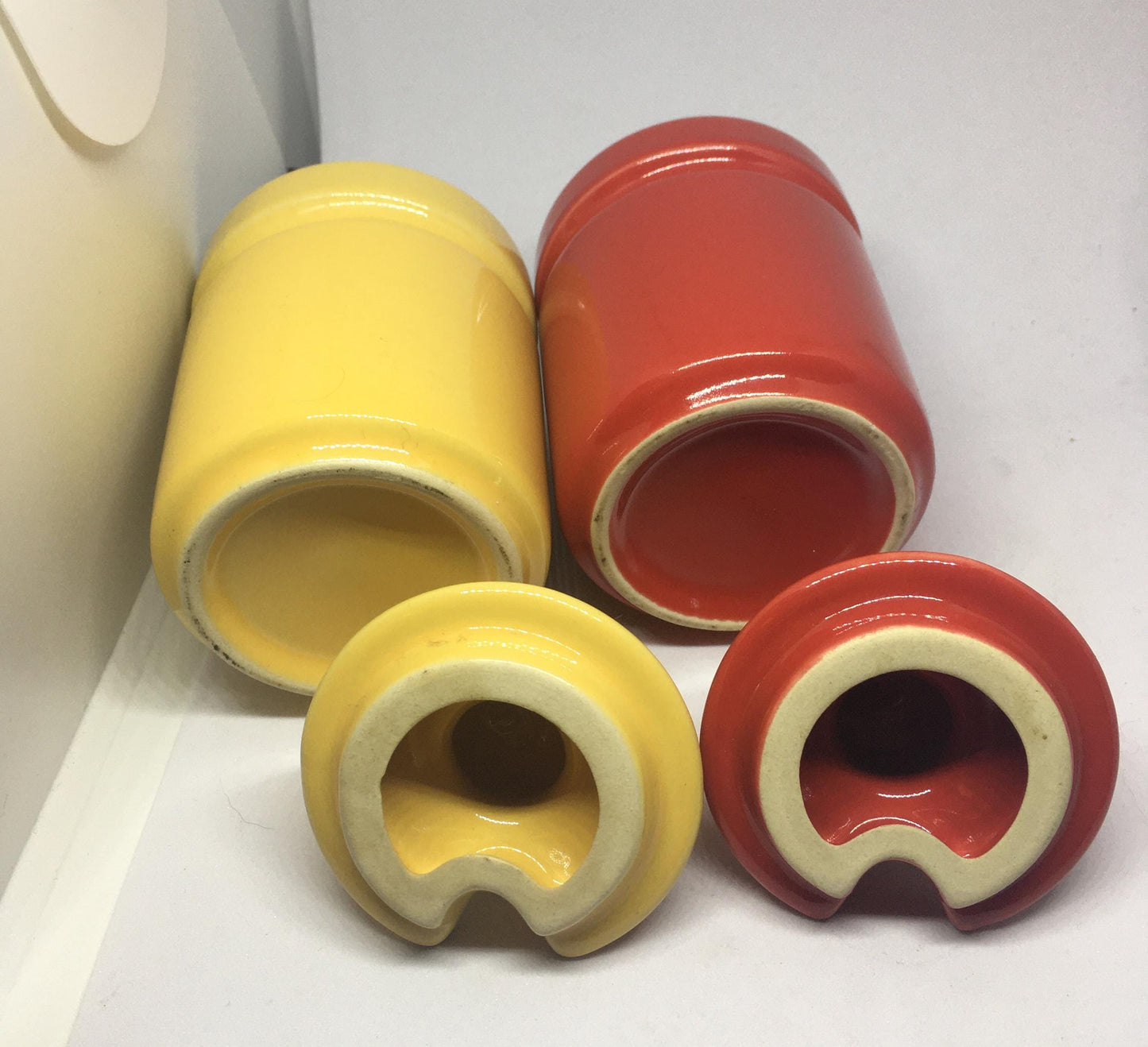 Ceramic lidded honey sugar pots. Vibrant red and yellow glazed set of vintage jam pots.