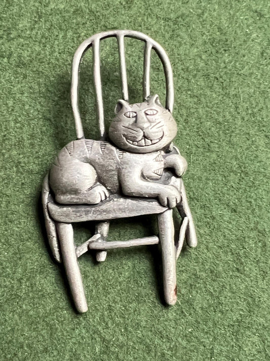 Vintage Cat brooch Signed JJ. Grinning Cheshire Cat sitting on a chair.