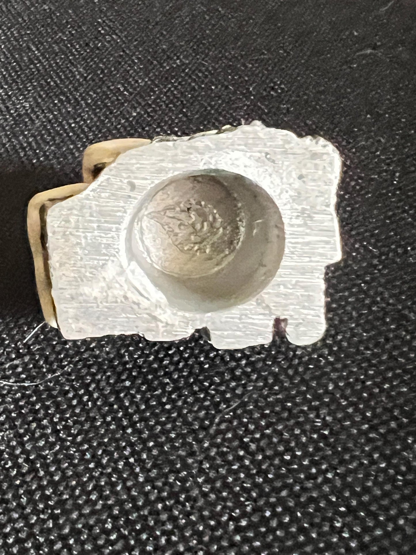 Miniature solid metal cast ornament snow covered Victorian shop.