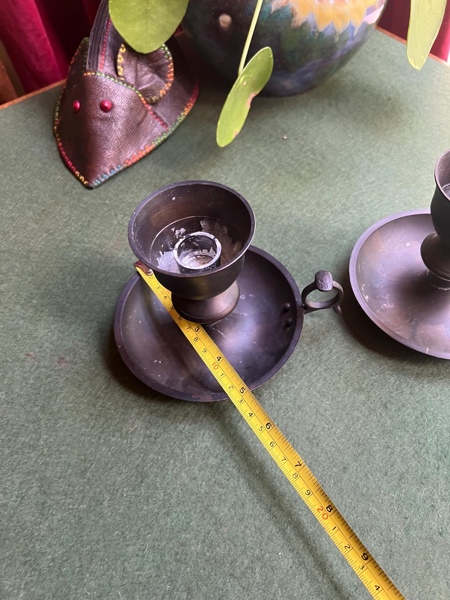 Vintage black metal thumb hold candle holder. Made in India stickers.