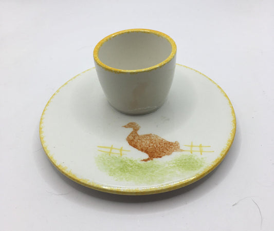 Vintage Silea stamped egg cup with spongeware duck goose design. Integrated saucer.