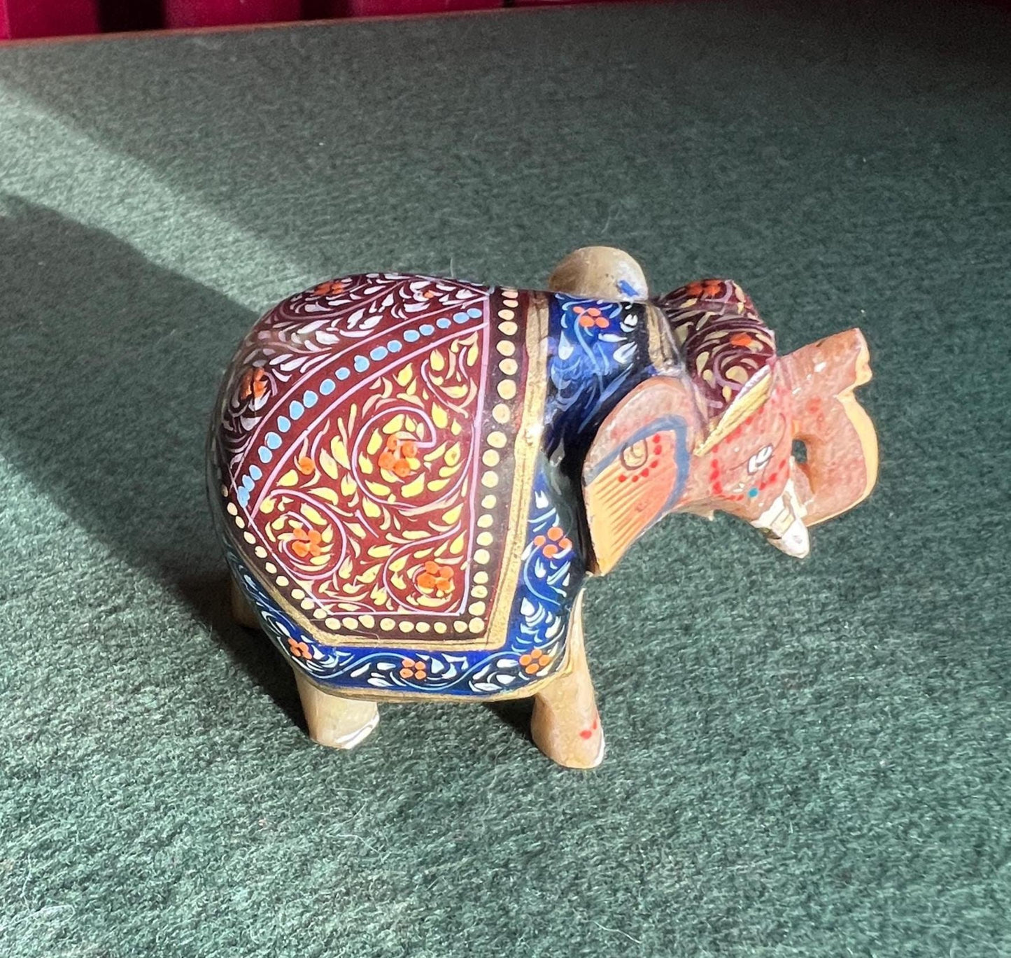 Decorative hand carved soapstone elephant in ceremonial dress.