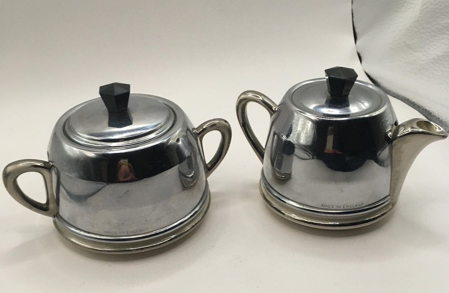 Vintage ceramic and metal insulated creamer and covered sugar bowl.