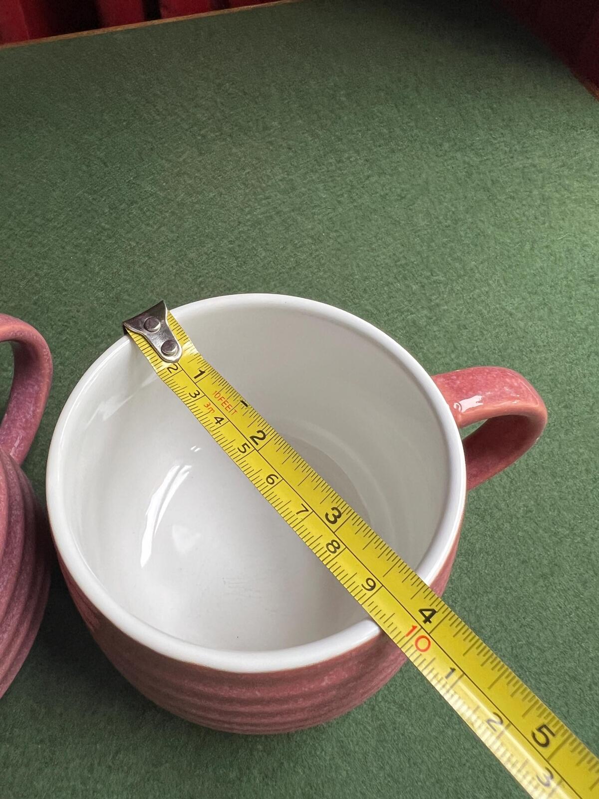 Pair of pink glaze coffee tea mugs. The Old Pottery Company,