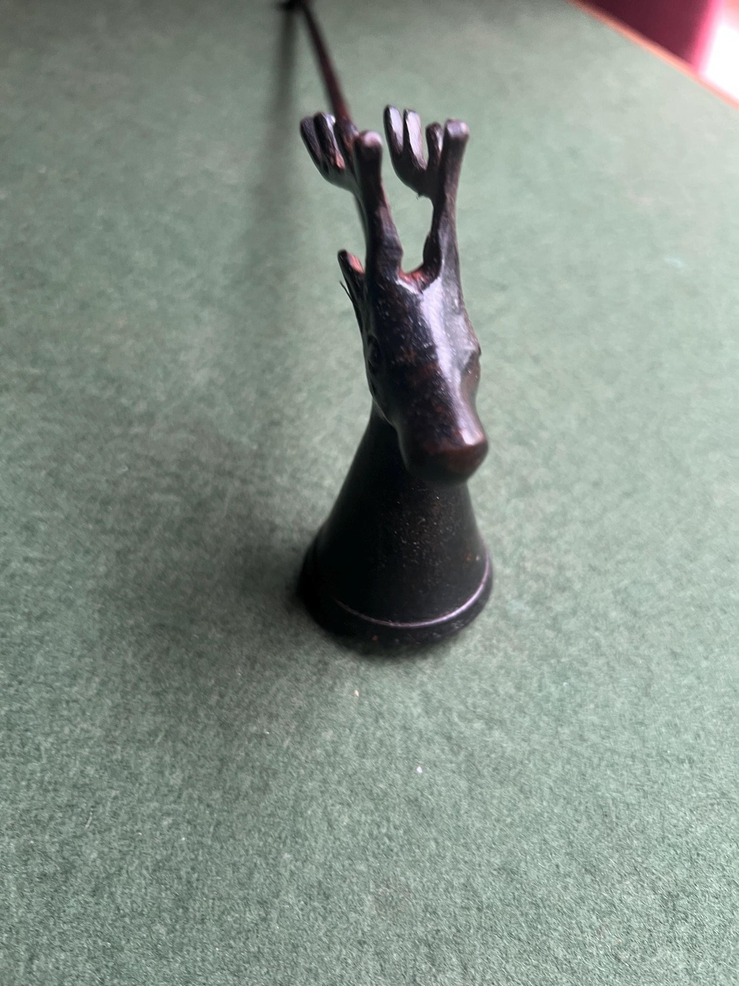 Vintage stag head candle snuffer. Black metal long handled candle extinguisher.