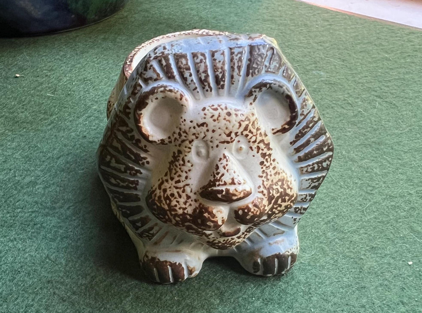 Stylised stone ware lion planter with original 'Julietta' Sticker.