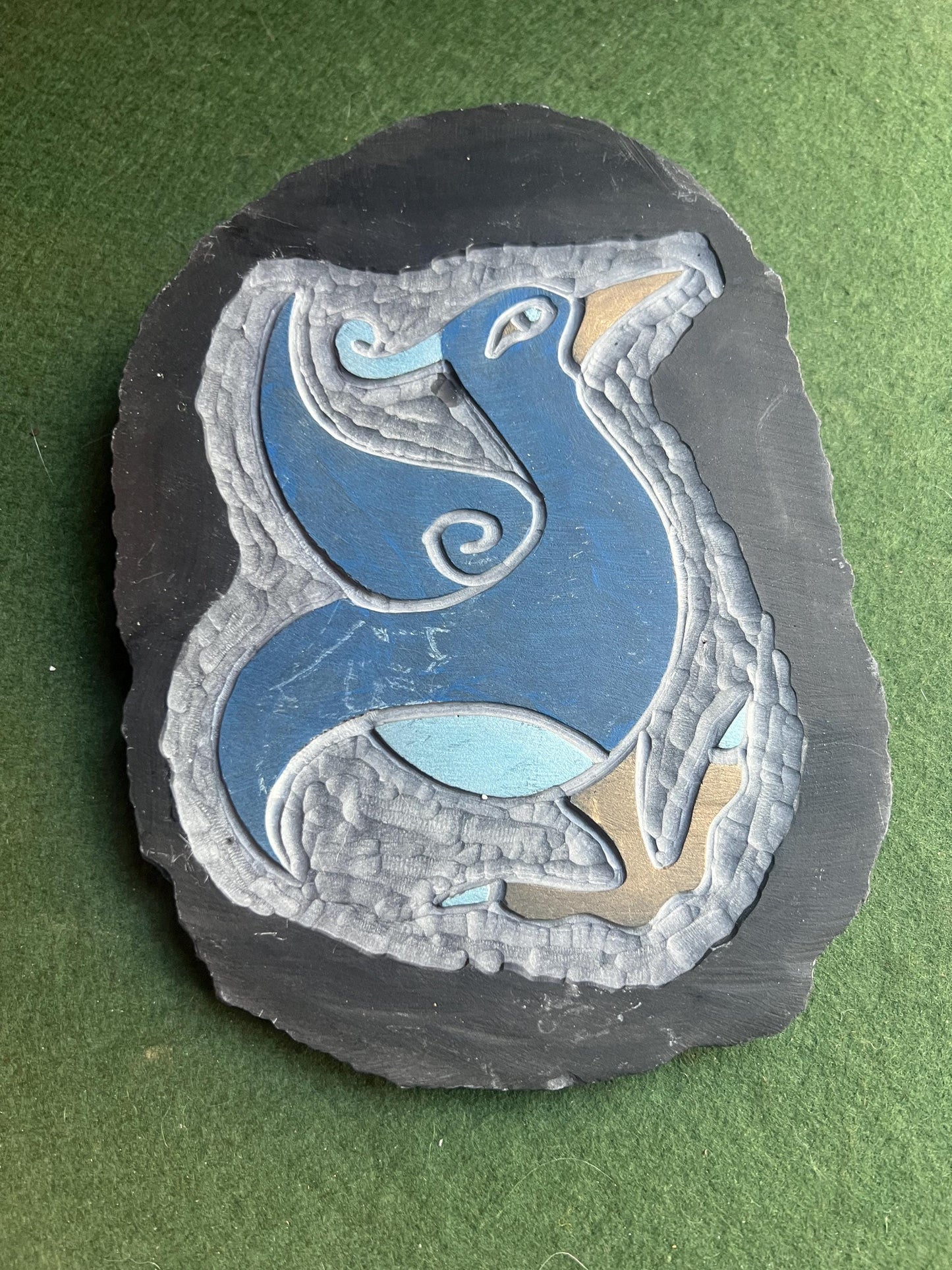 Stylised bird slate carving wall decor.