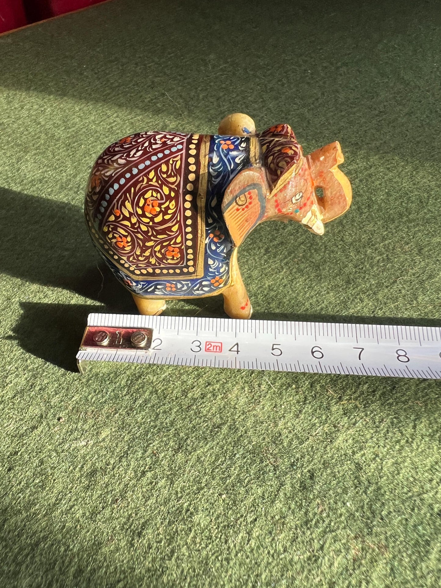 Decorative hand carved soapstone elephant in ceremonial dress.