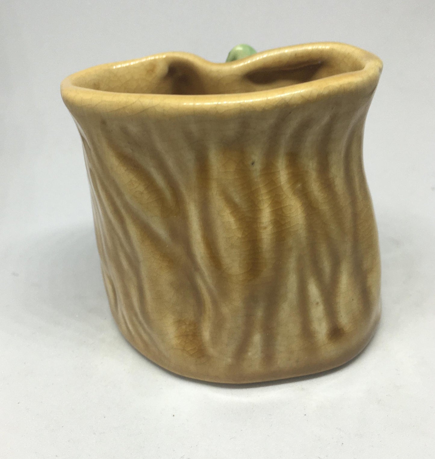 Campsie Ware green bunny by a tree stump planter vase.