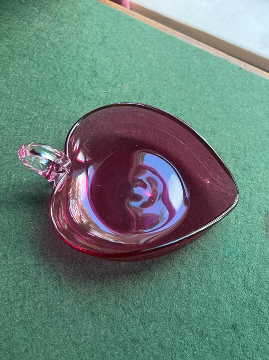 Hand blown cranberry glass heart shaped trinket dish. Applied clear handle.