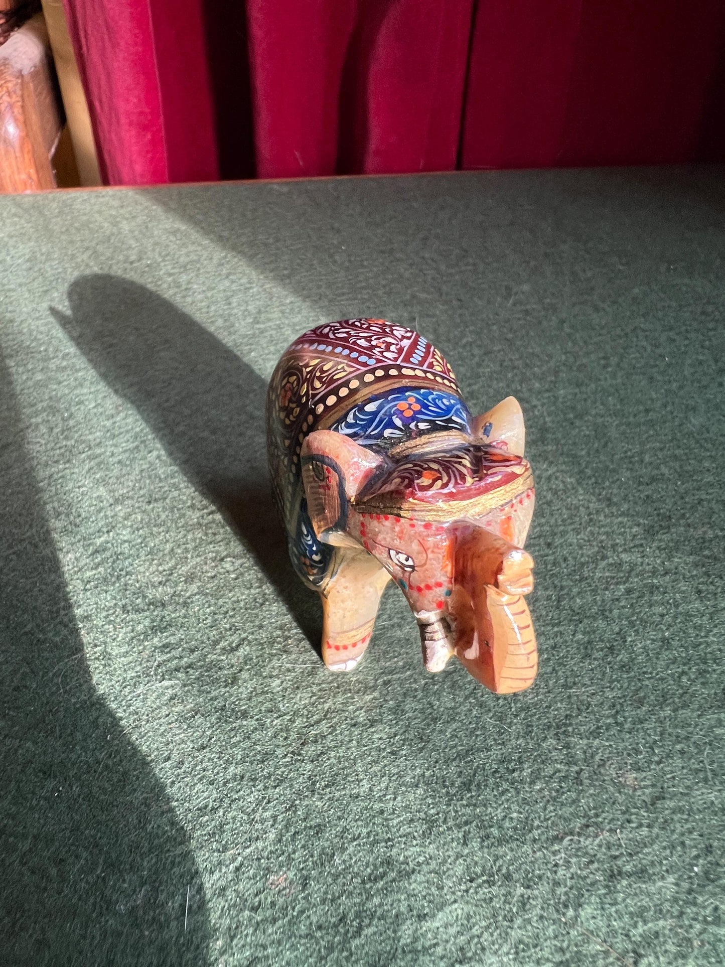 Decorative hand carved soapstone elephant in ceremonial dress.