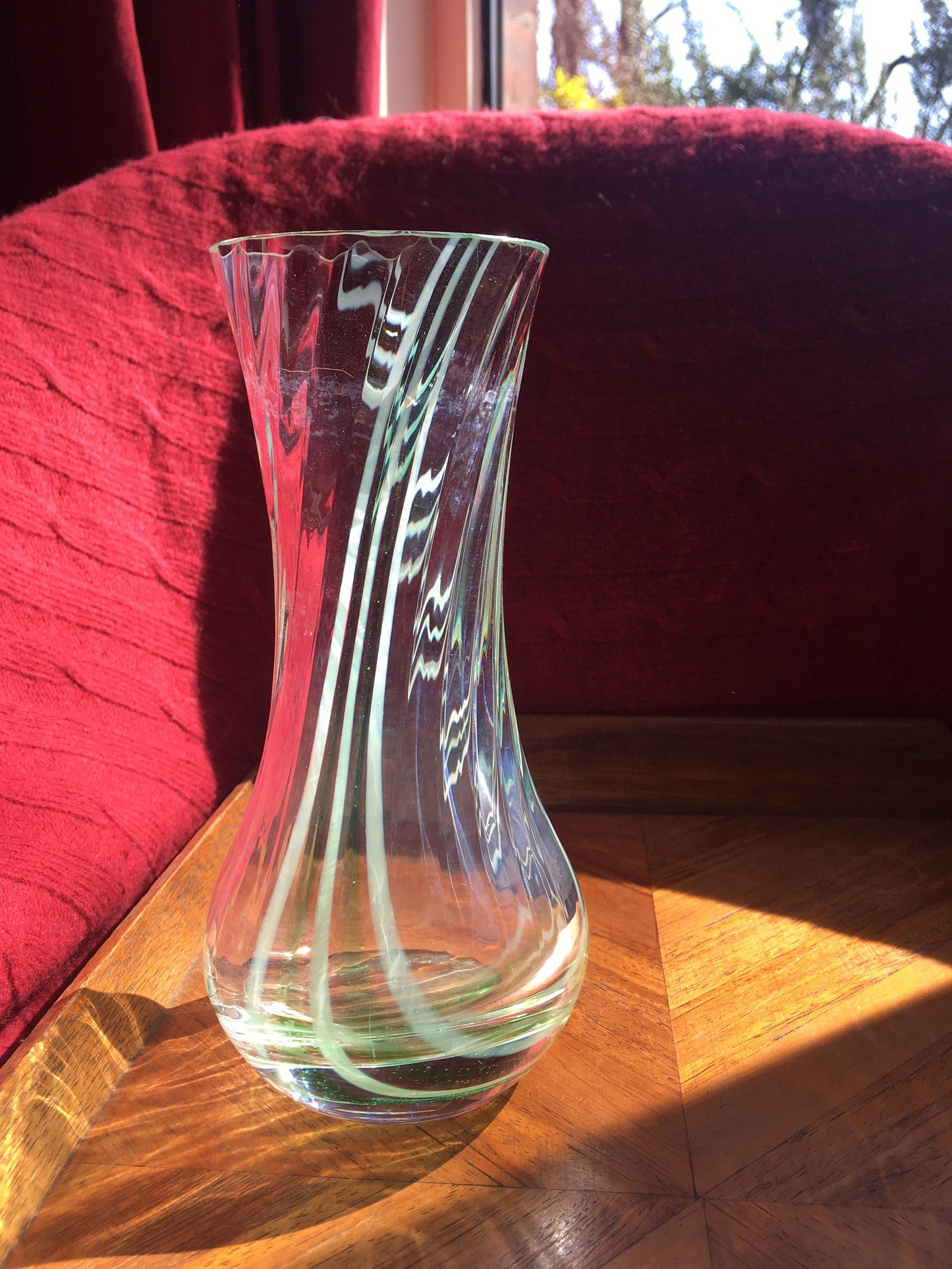 Beautiful vintage clear glass flower vase with green swirl detail. Heavy based.