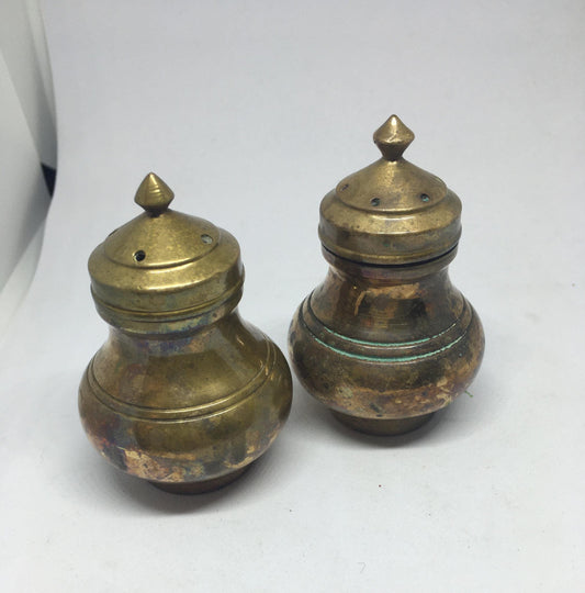 Unusual brass salt and pepper shakers. Screw off lids plastic inserts. Some oxidation.