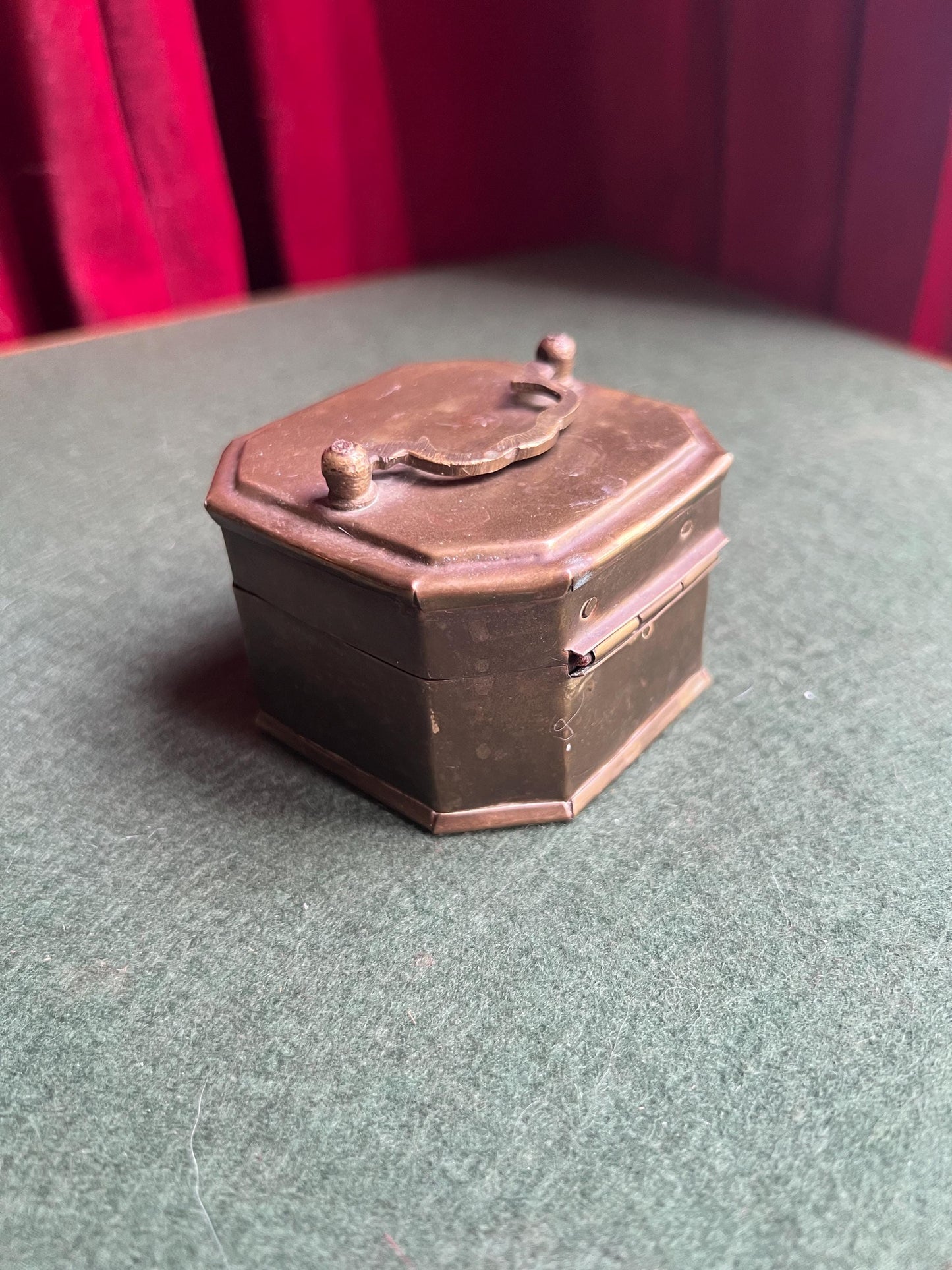 Antique Vintage brass octagonal lidded box. Great patina. Hinged trinket stash box with handle and clasp.