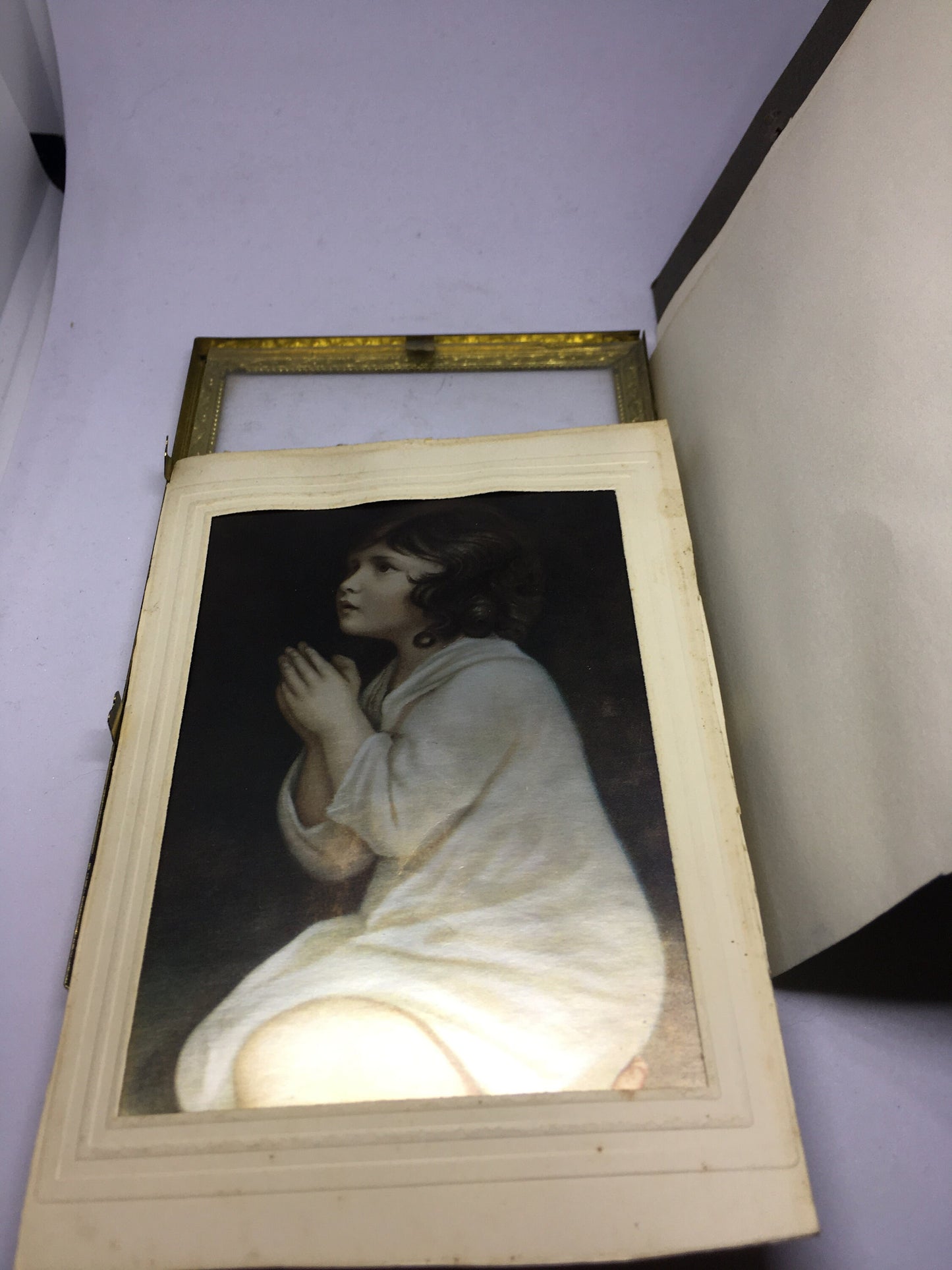 Beautiful framed iridescent photo of a little girl praying. Personalised letter in the back. Danish design.