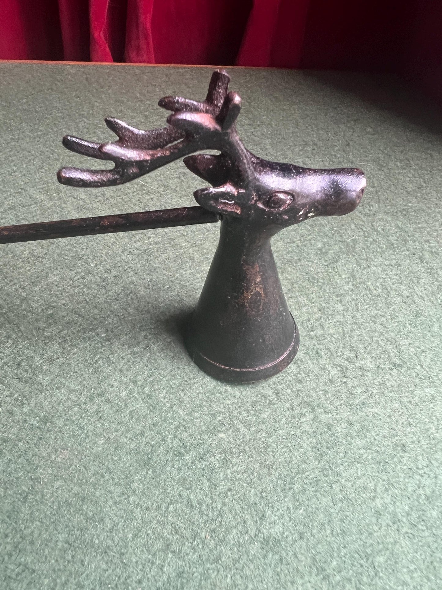 Vintage stag head candle snuffer. Black metal long handled candle extinguisher.