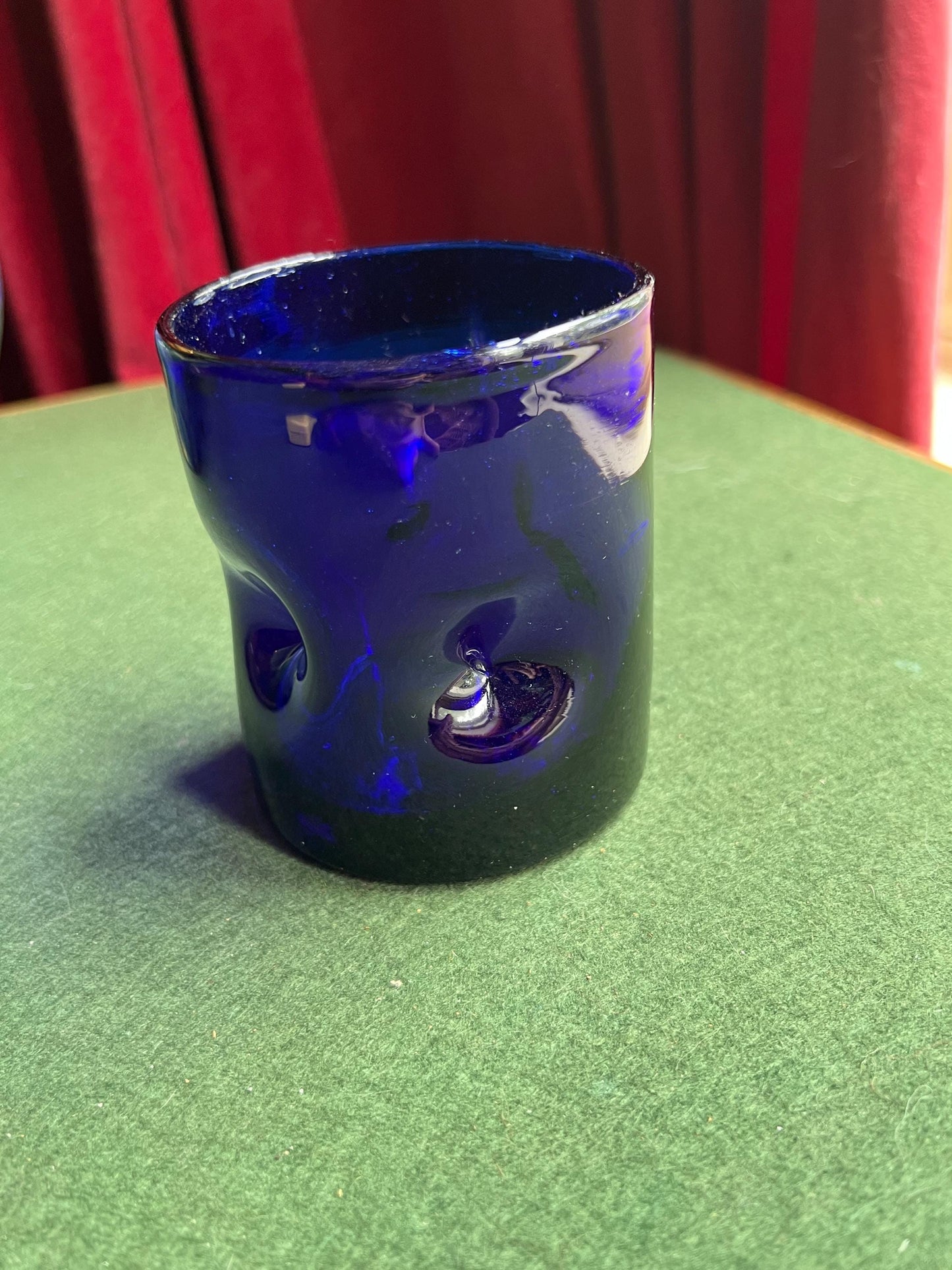 Pinched hand blown glass cobalt blue drinking glass posy vase.
