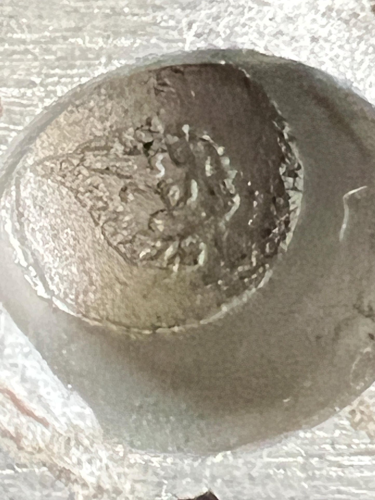 Miniature solid metal cast ornament snow covered Victorian shop.