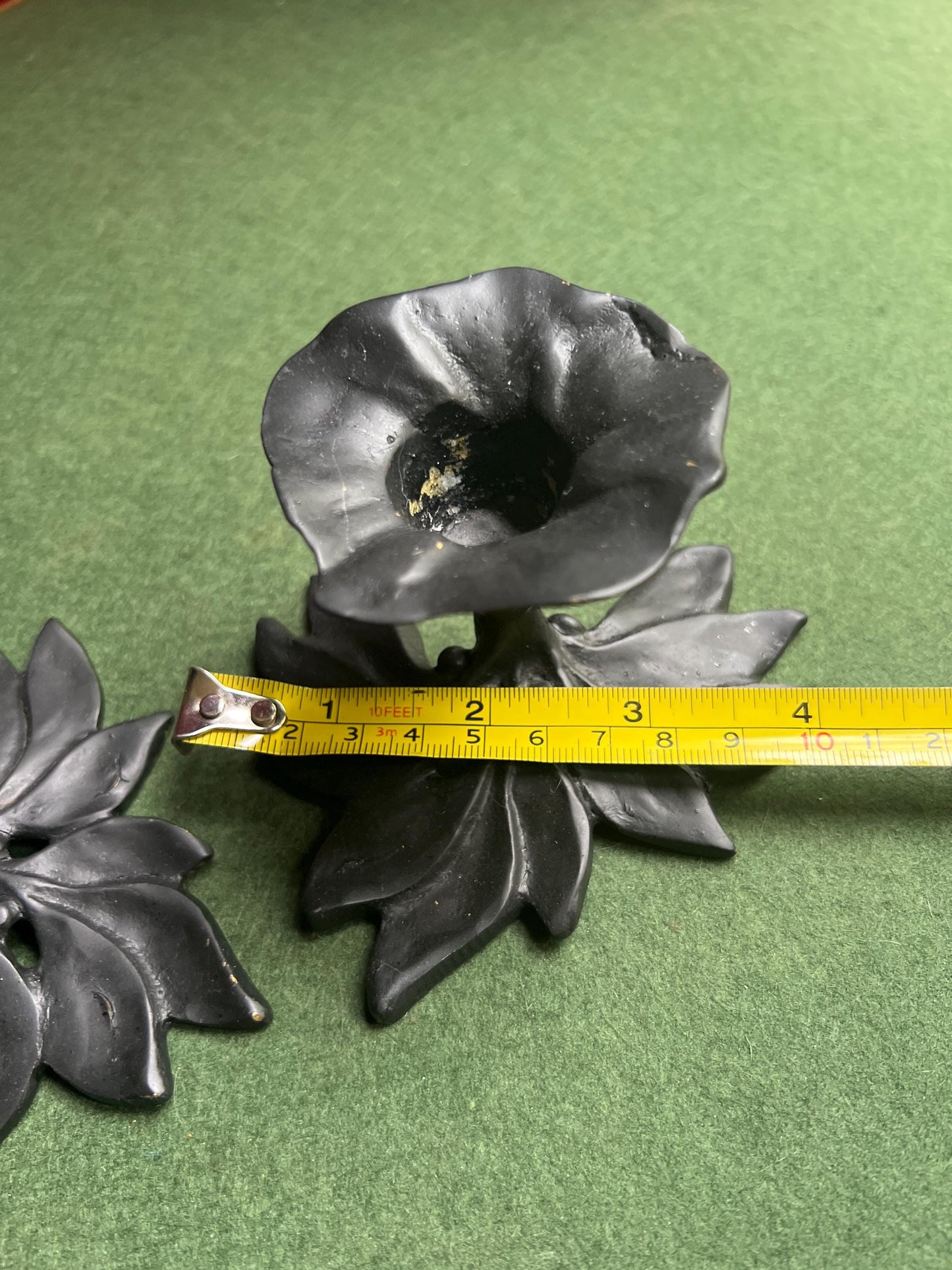 Pair of metal flower shaped candle holders Black metal trumpet flower with leaves