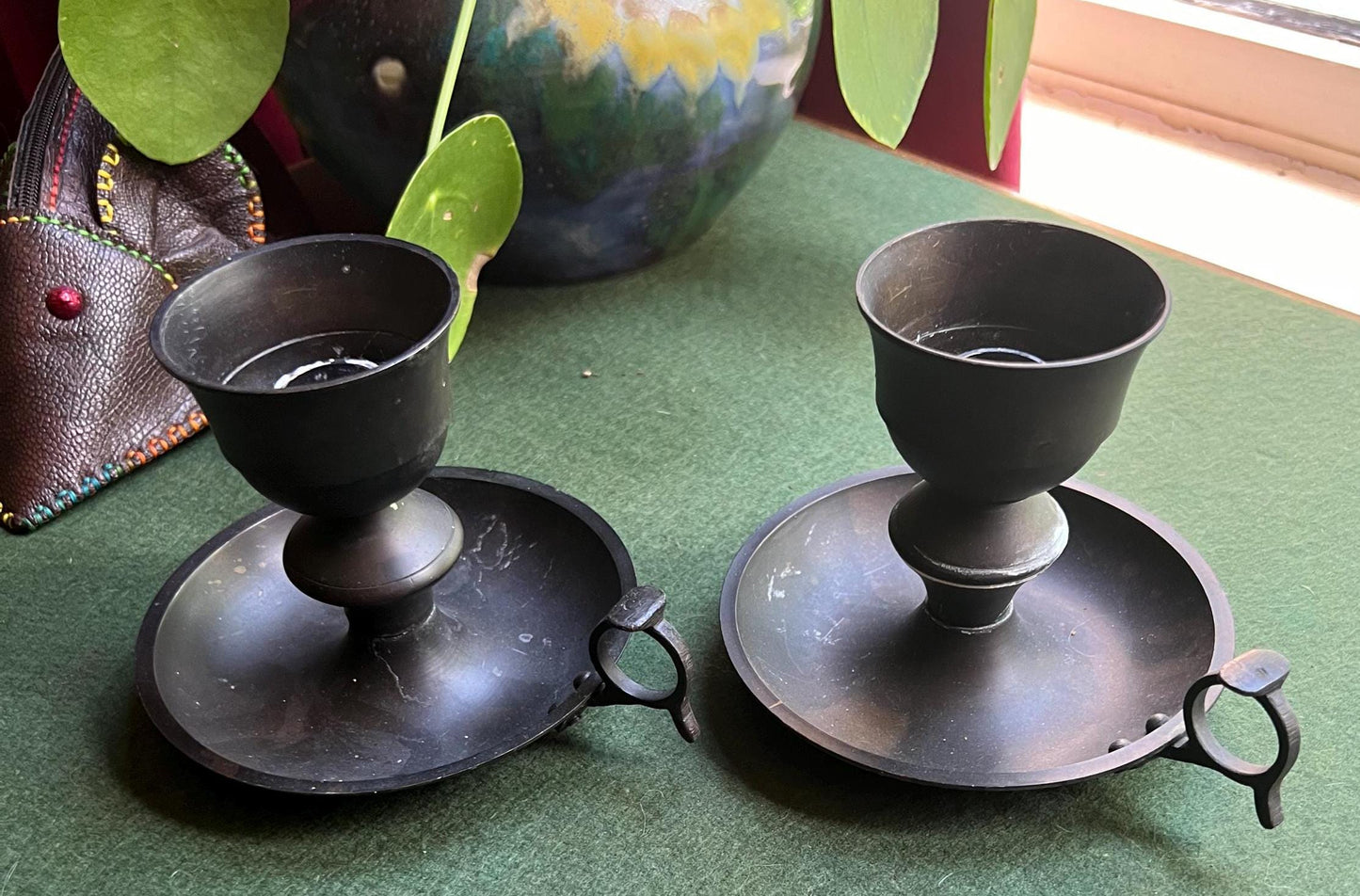 Vintage black metal thumb hold candle holder. Made in India stickers.