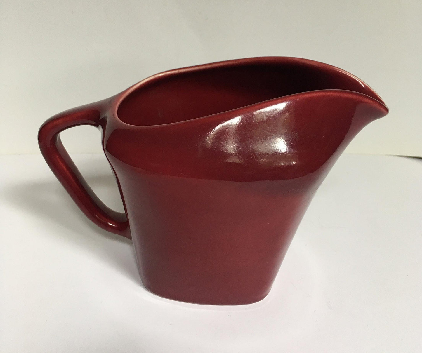 Rare Vintage red milk jug creamer Deep red glazed gravy custard serving jug. Stamped South Seas JG Meakin.