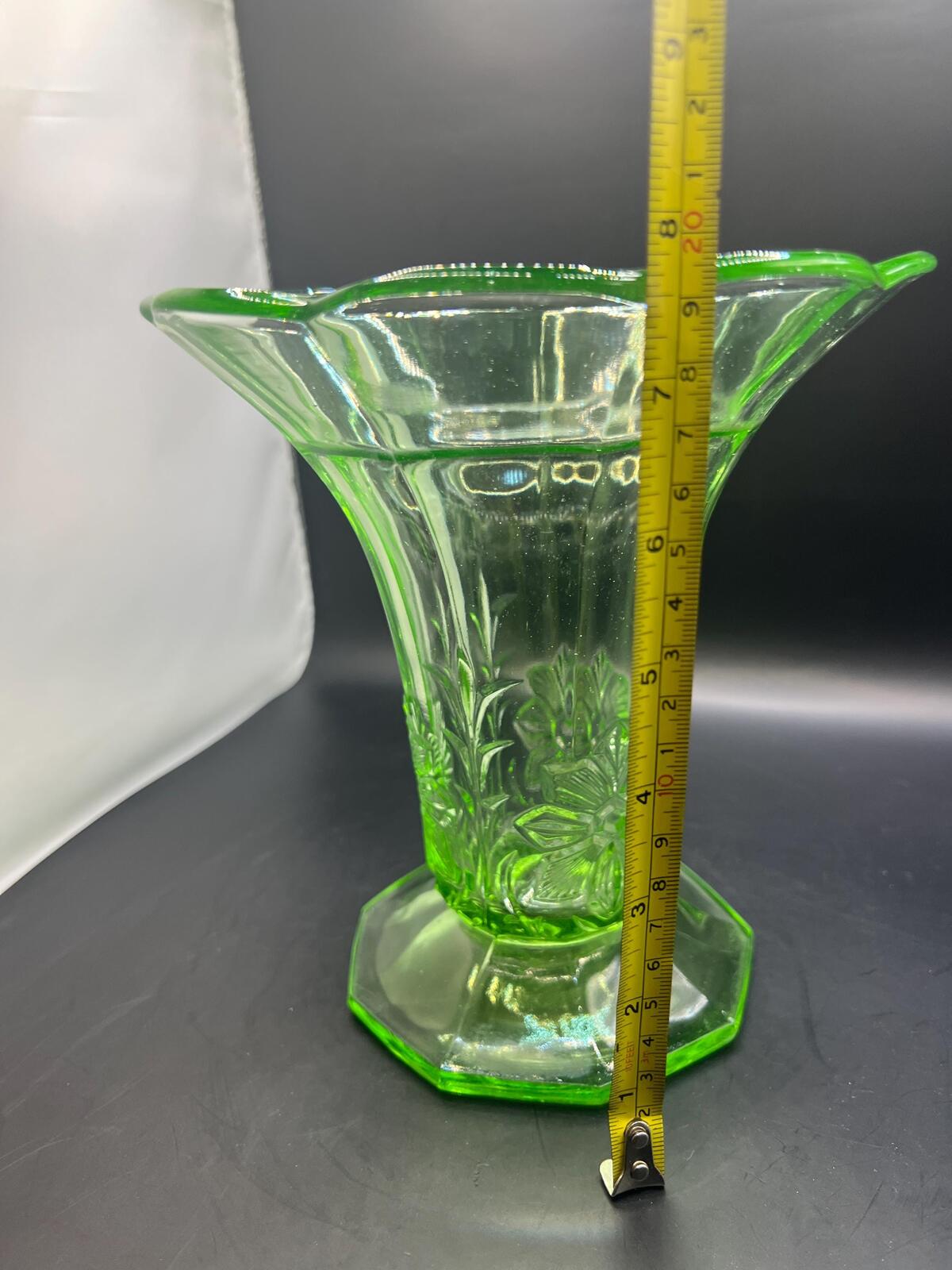 Vintage antique uranium glass vase. Octagonal base with flared ruffle rim and floral imprint.