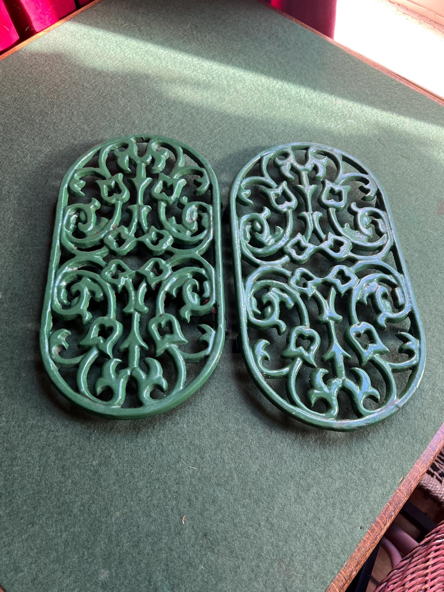 Vintage cast iron trivets. Large Oval green 4 footed trivets. 2 available. Sold separately.