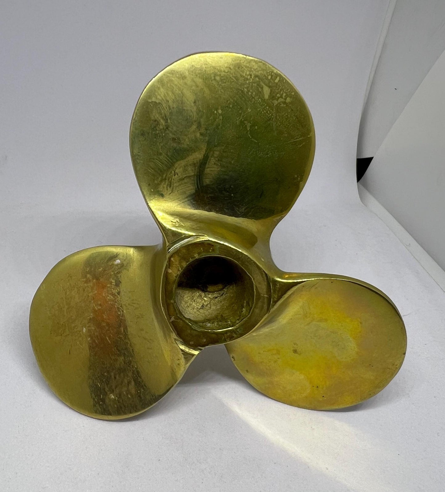 Brass candle stick Propellor shaped candle holder.