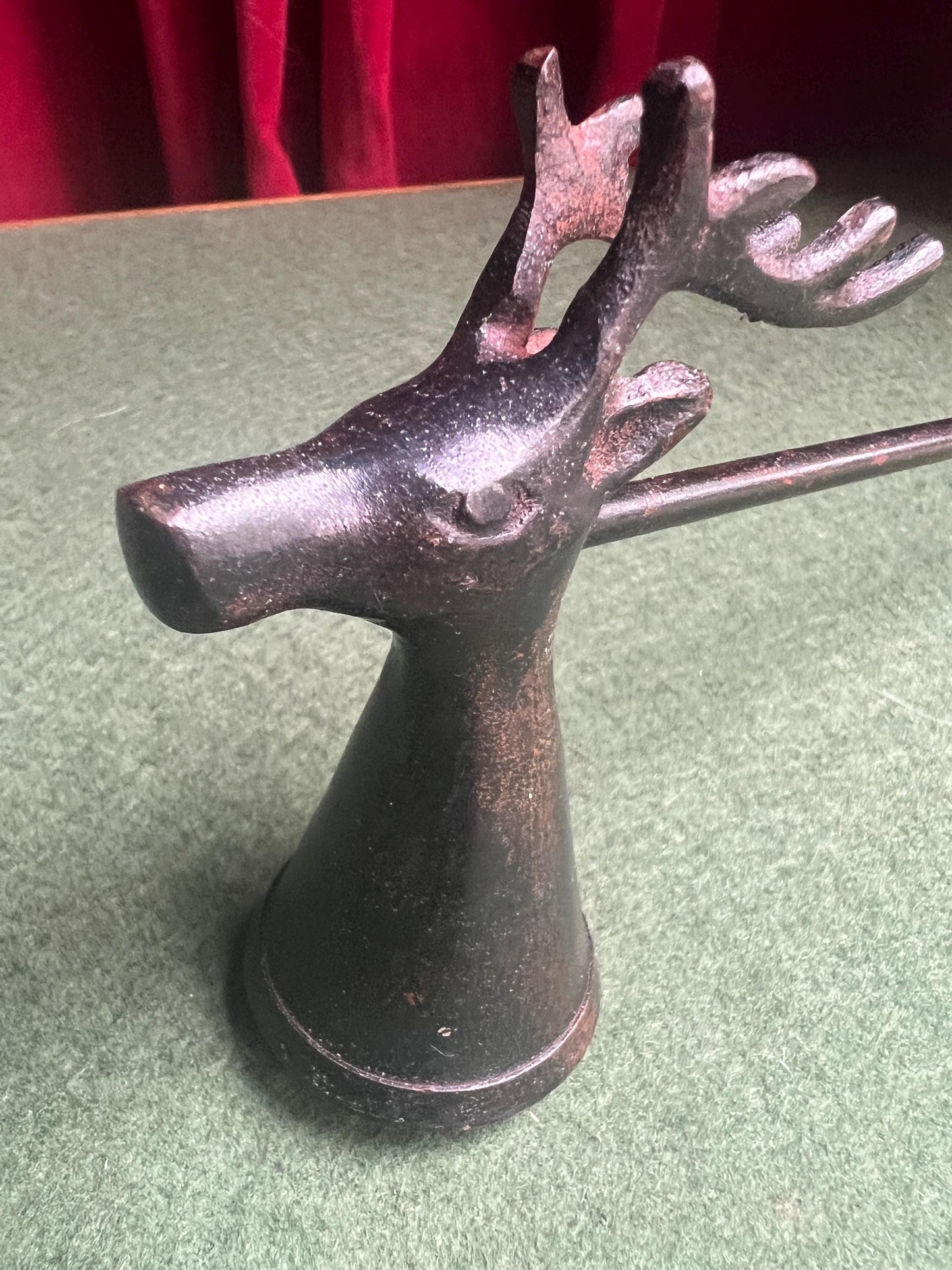 Vintage stag head candle snuffer. Black metal long handled candle extinguisher.